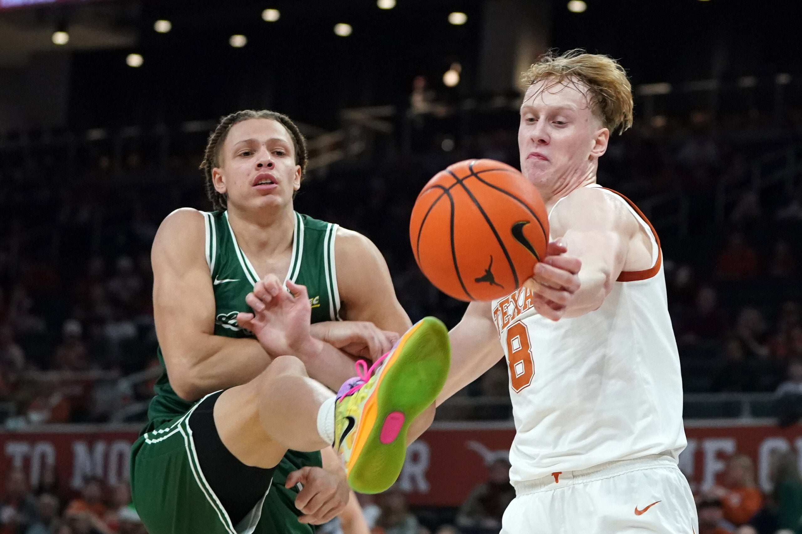 Dec 16, 2025; Austin, Texas, USA; Texas Longhorns center Matas Vokietaitis (8) rebounds against Le Moyne Dolphins forward Shilo Jackson (4) during the first half at Moody Center. Mandatory Credit: Dustin Safranek-Imagn Images