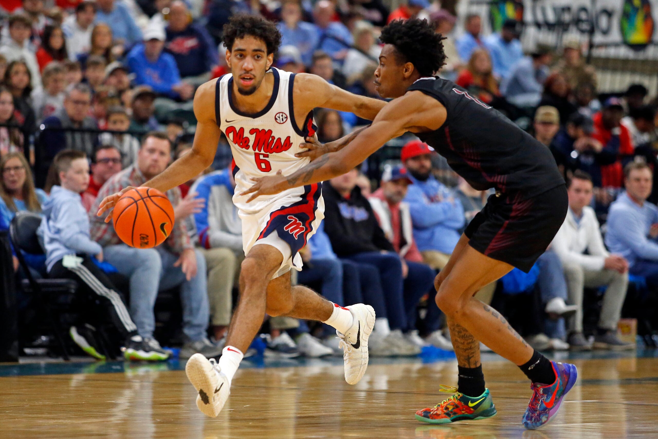 Dec 17, 2025; Tupelo, Mississippi, USA; Mississippi Rebels guard Ilias Kamardine (6) dribbles as Alabama A&M Bulldogs guard Koron Davis (1) defends during the second half at Cadence Bank Arena. Mandatory Credit: Petre Thomas-Imagn Images