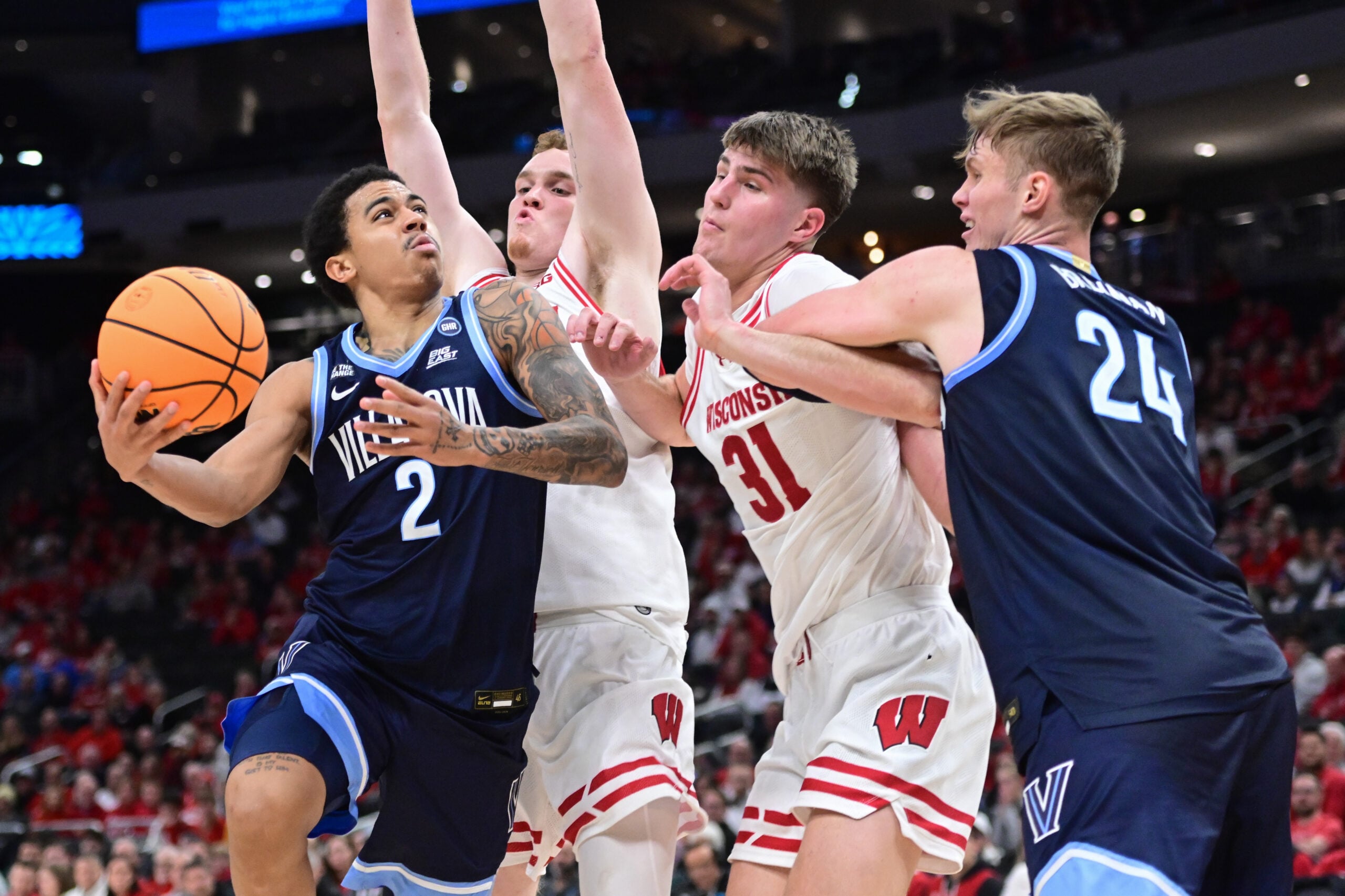 Dec 19, 2025; Milwaukee, Wisconsin, USA; Villanova Wildcats guard Bryce Lindsay (2) takes a shot against Wisconsin Badgers forward Nolan Winter (31) in the second half at the Fiserv Forum. Mandatory Credit: Benny Sieu-Imagn Images