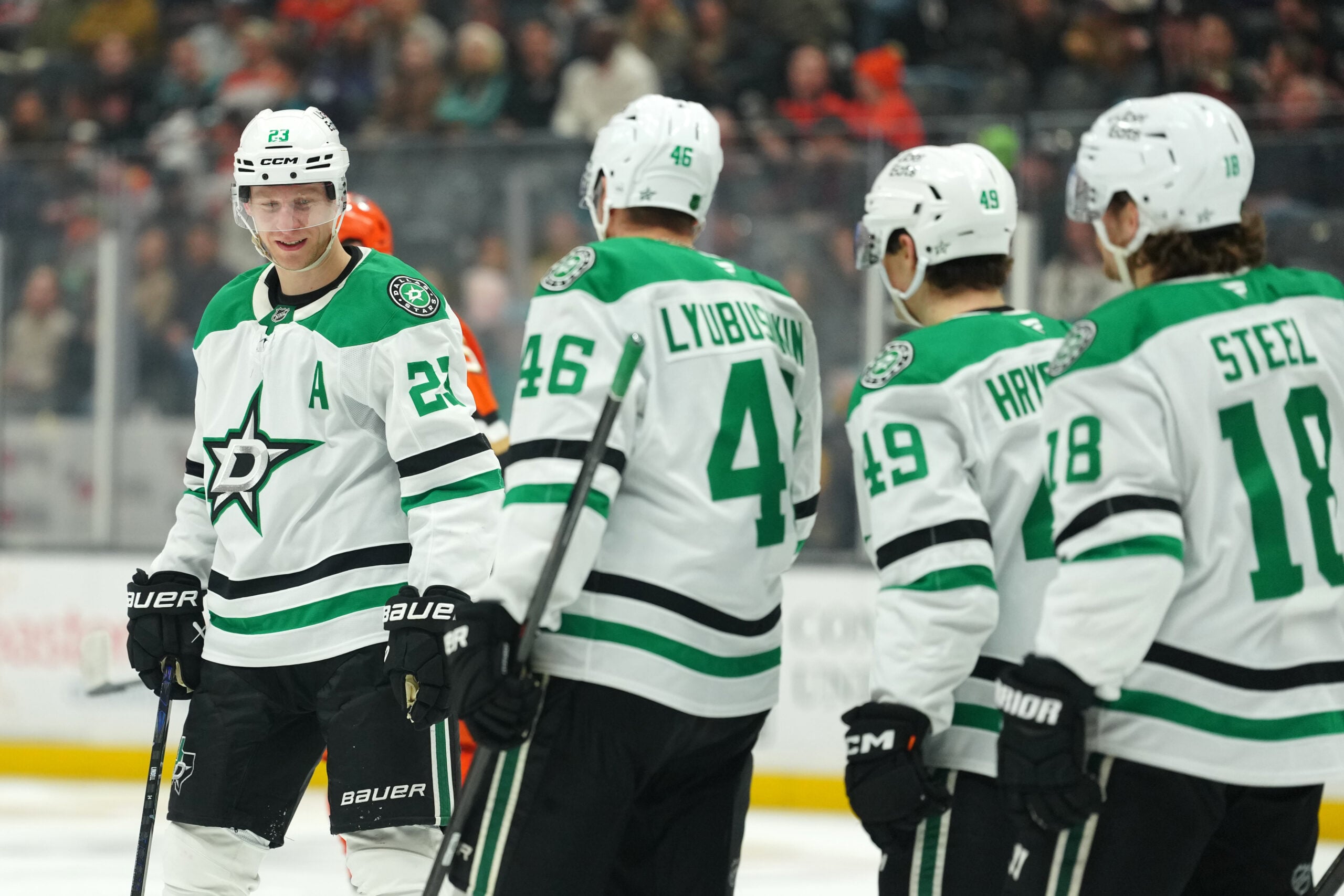 Dec 19, 2025; Anaheim, California, USA; Dallas Stars defenseman Esa Lindell (23) celebrates with defenseman Ilya Lyubushkin (46), center Justin Hryckowian (49) and center Sam Steel (18) after a goal Anaheim Ducks in the third period at Honda Center. Mandatory Credit: Kirby Lee-Imagn Images