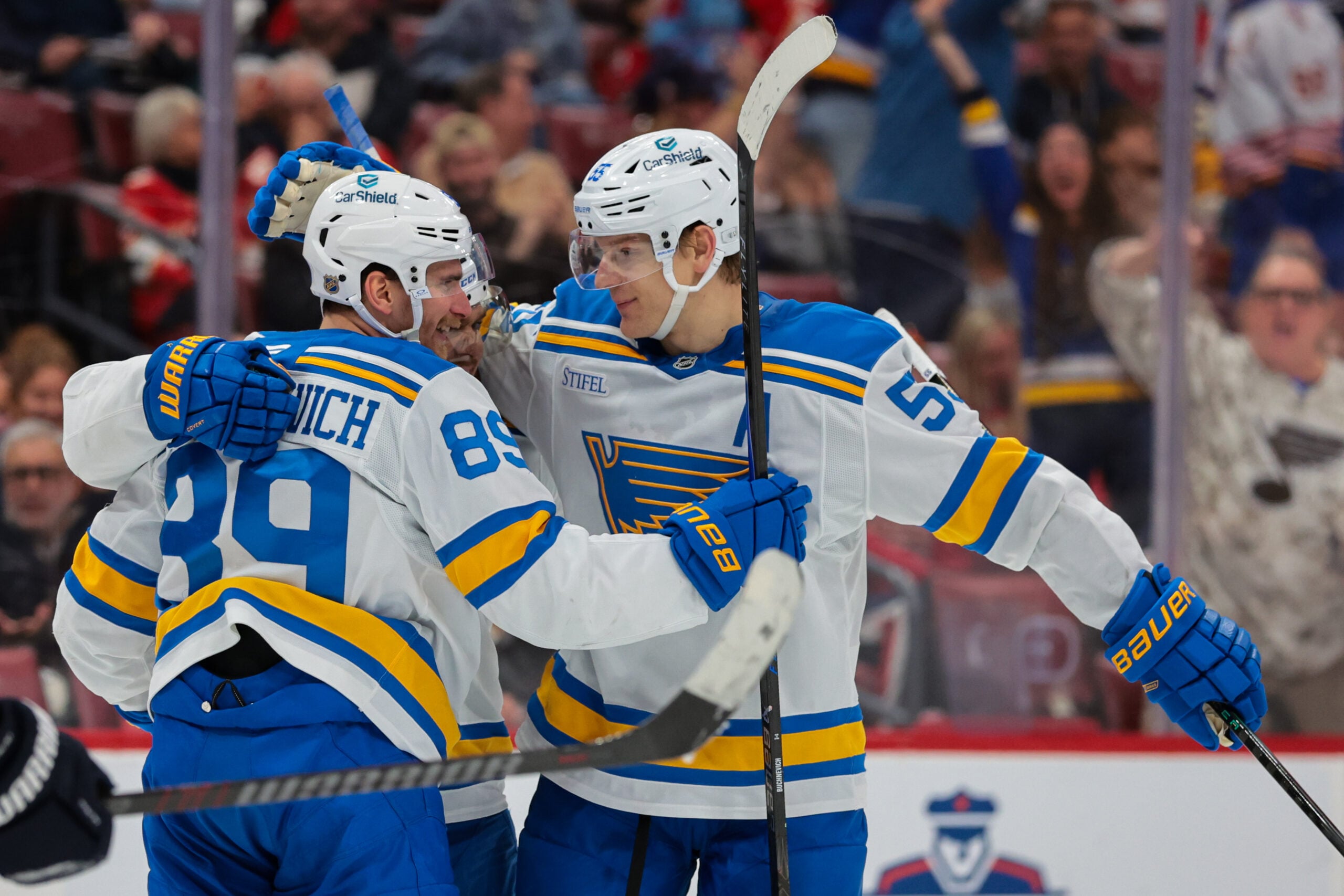 Dec 20, 2025; Sunrise, Florida, USA; St. Louis Blues left wing Pavel Buchnevich (89) and defenseman Colton Parayko (55) celebrate after a goal by center Robert Thomas (not pictured) against the Florida Panthers during the third period at Amerant Bank Arena. Mandatory Credit: Sam Navarro-Imagn Images