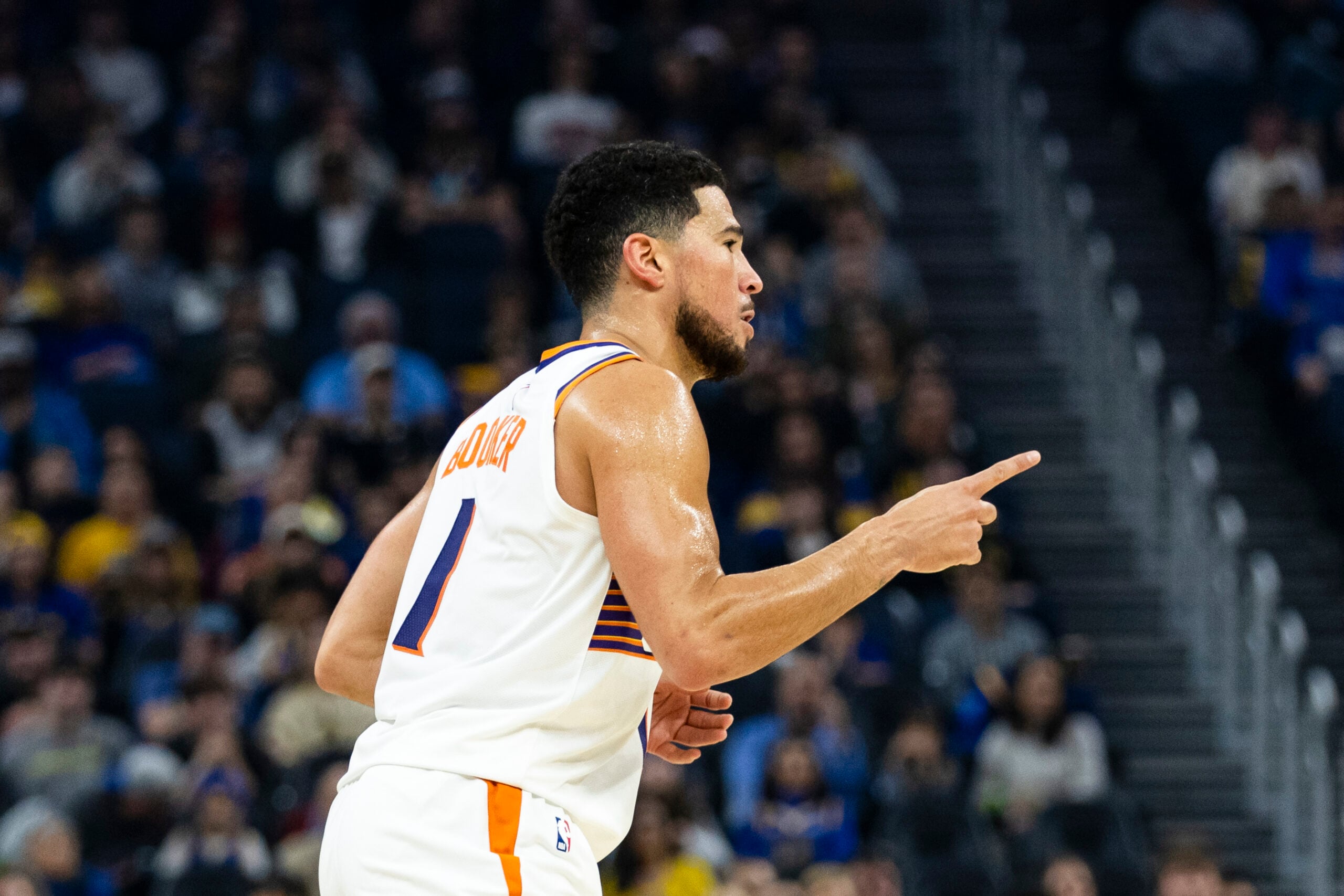 Dec 20, 2025; San Francisco, California, USA; Phoenix Suns guard Devin Booker (1) reacts after he hit a three-point shot against the Golden State Warriors during the first quarter at Chase Center. Mandatory Credit: John Hefti-Imagn Images