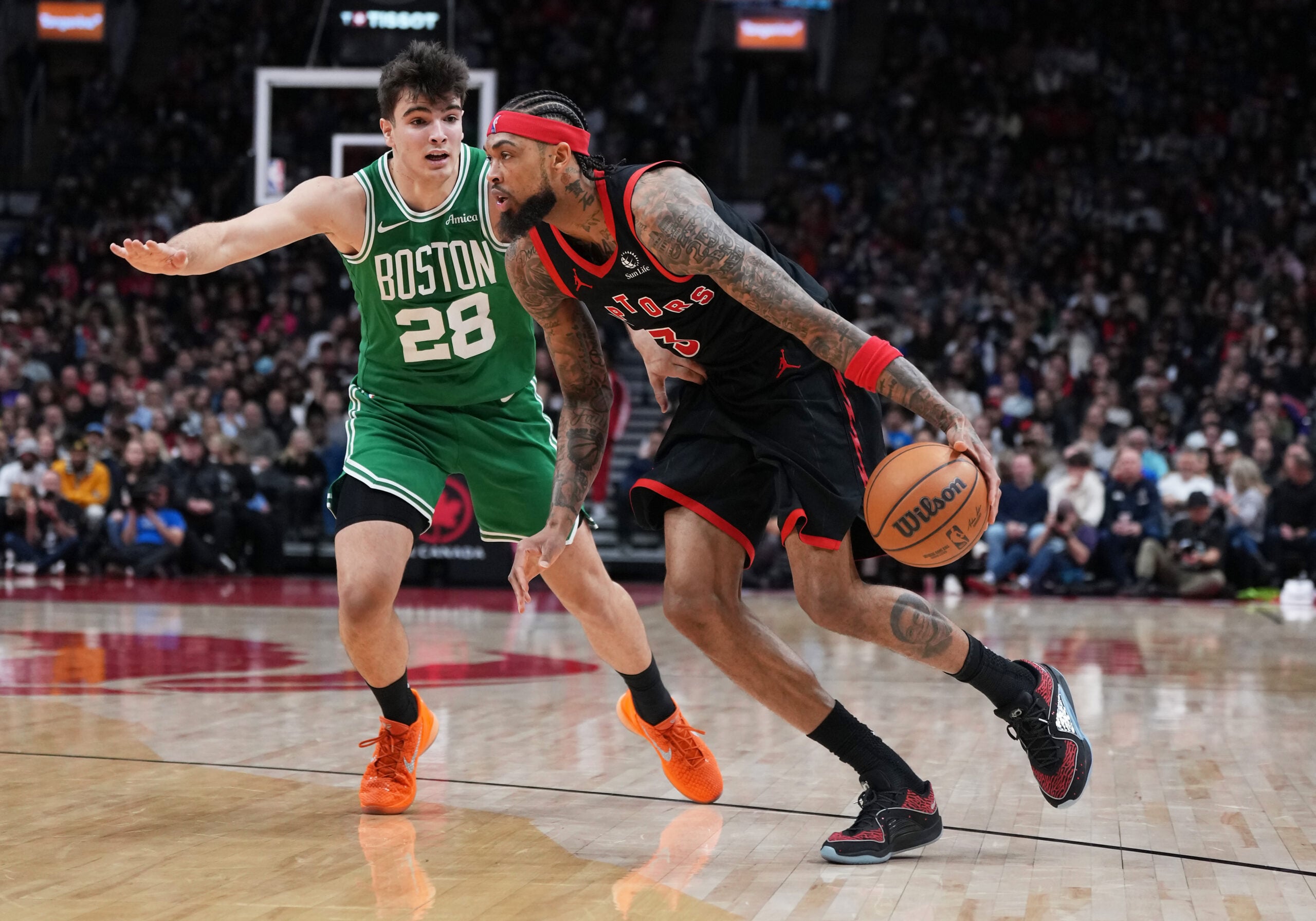 Dec 20, 2025; Toronto, Ontario, CAN; Toronto Raptors forward Brandon Ingram (3) controls the ball as Boston Celtics guard Hugo Gonzalez (28) tries to defend during the fourth quarter at Scotiabank Arena. Mandatory Credit: Nick Turchiaro-Imagn Images