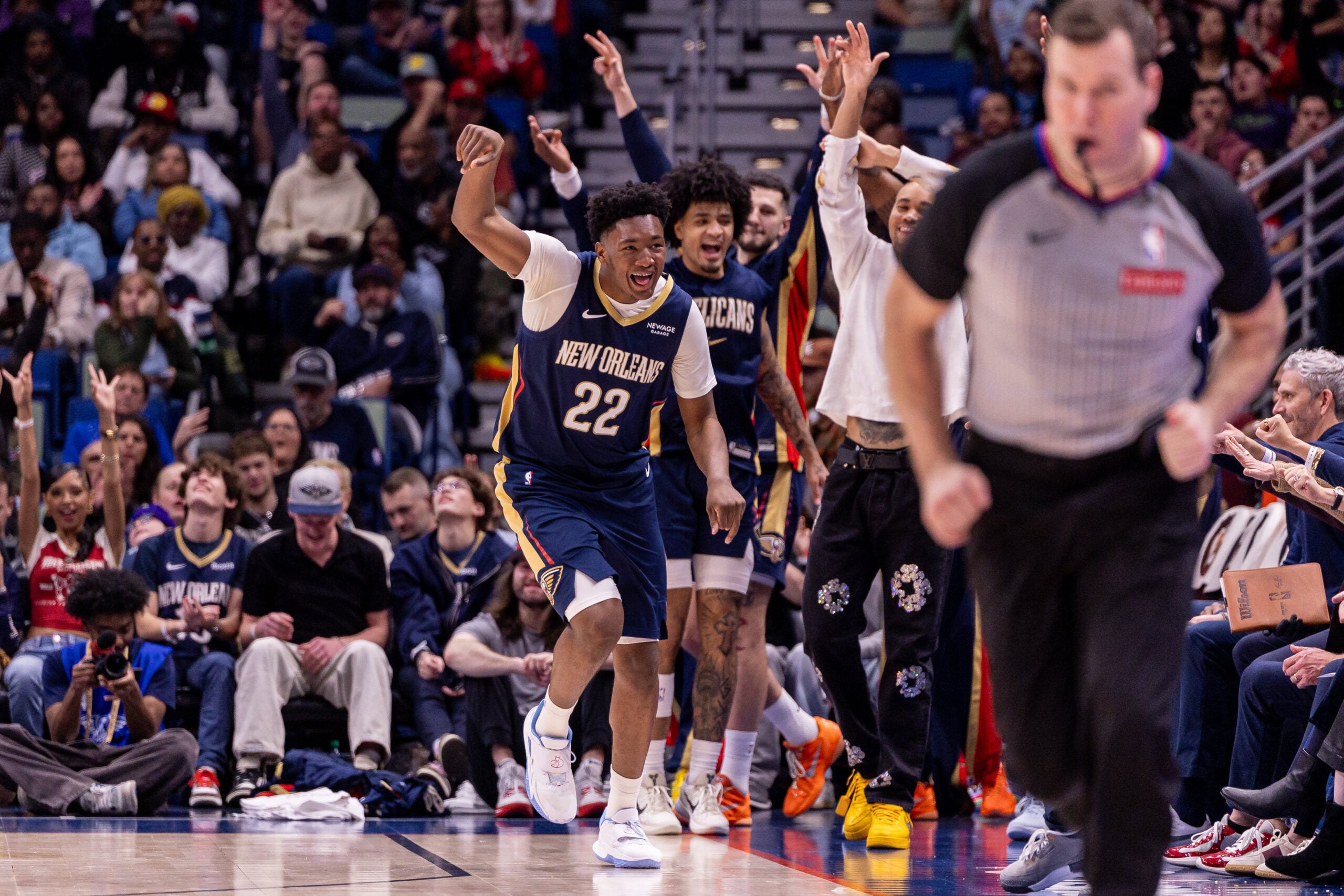 Dec 20, 2025; New Orleans, Louisiana, USA;  New Orleans Pelicans center Derik Queen (22) reacts to making a three point basket against the Indiana Pacers during the second half at Smoothie King Center. Mandatory Credit: Stephen Lew-Imagn Images