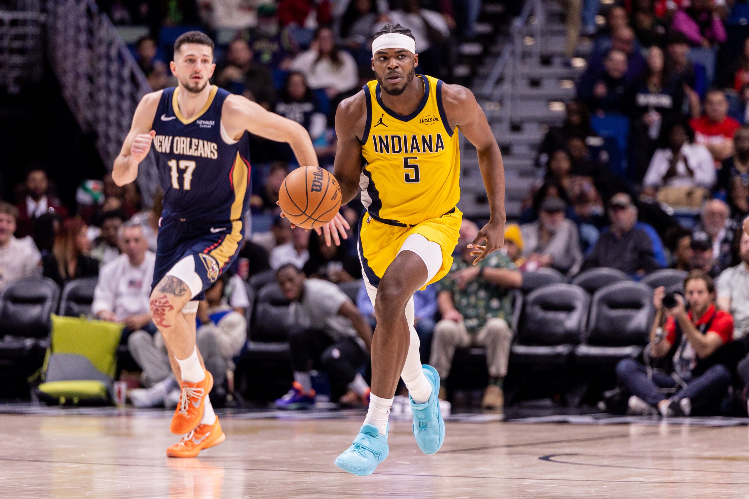 Dec 20, 2025; New Orleans, Louisiana, USA;  Indiana Pacers forward Jarace Walker (5) brings the ball up court against New Orleans Pelicans forward/center Karlo Matkovi? (17) during the second half at Smoothie King Center. Mandatory Credit: Stephen Lew-Imagn Images