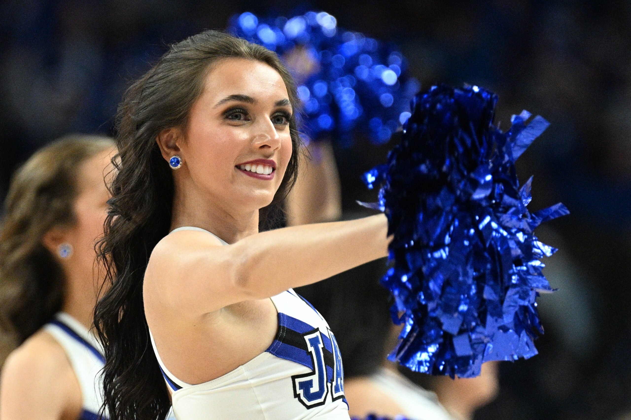 Dec 20, 2025; Omaha, Nebraska, USA;  A cheerleader for the Creighton Bluejays performs during a break in the game against the Marquette Golden Eagles during the second half at CHI Health Center Omaha. Mandatory Credit: Steven Branscombe-Imagn Images