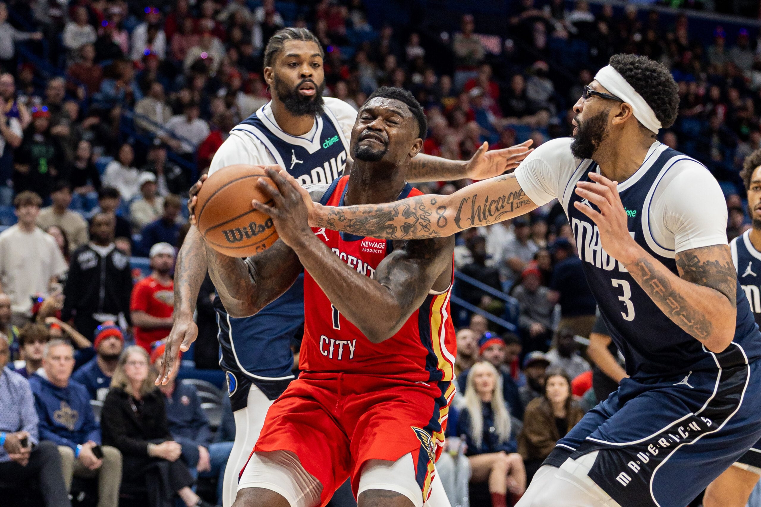 Dec 22, 2025; New Orleans, Louisiana, USA;  New Orleans Pelicans forward Zion Williamson (1) is fouled by Dallas Mavericks forward/center Anthony Davis (3) as he goes to the basket during the second half at Smoothie King Center. Mandatory Credit: Stephen Lew-Imagn Images