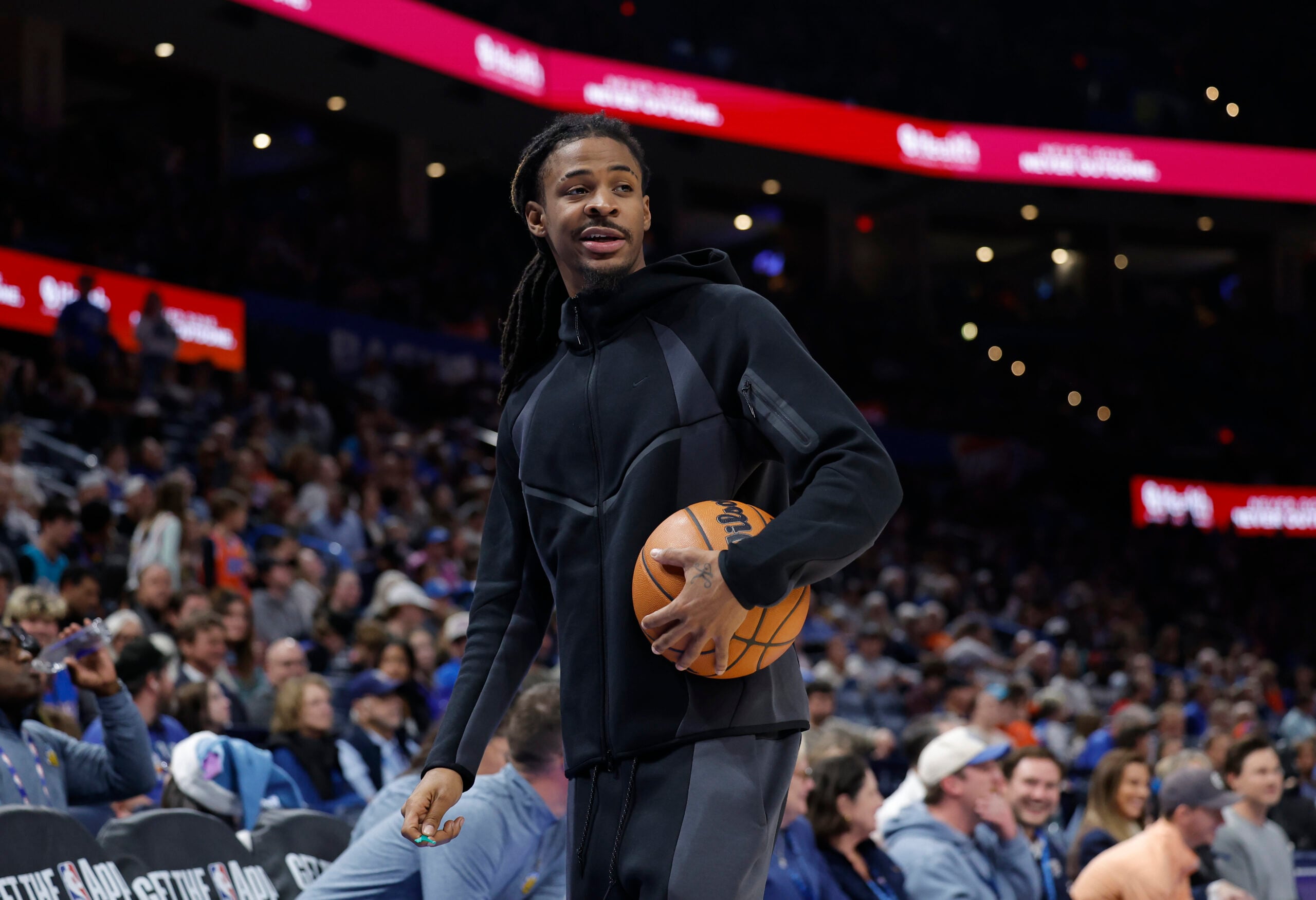Dec 22, 2025; Oklahoma City, Oklahoma, USA; Memphis Grizzlies guard Ja Morant (12) walks off the court during a time out against the Oklahoma City Thunder during the second half at Paycom Center. Mandatory Credit: Alonzo Adams-Imagn Images