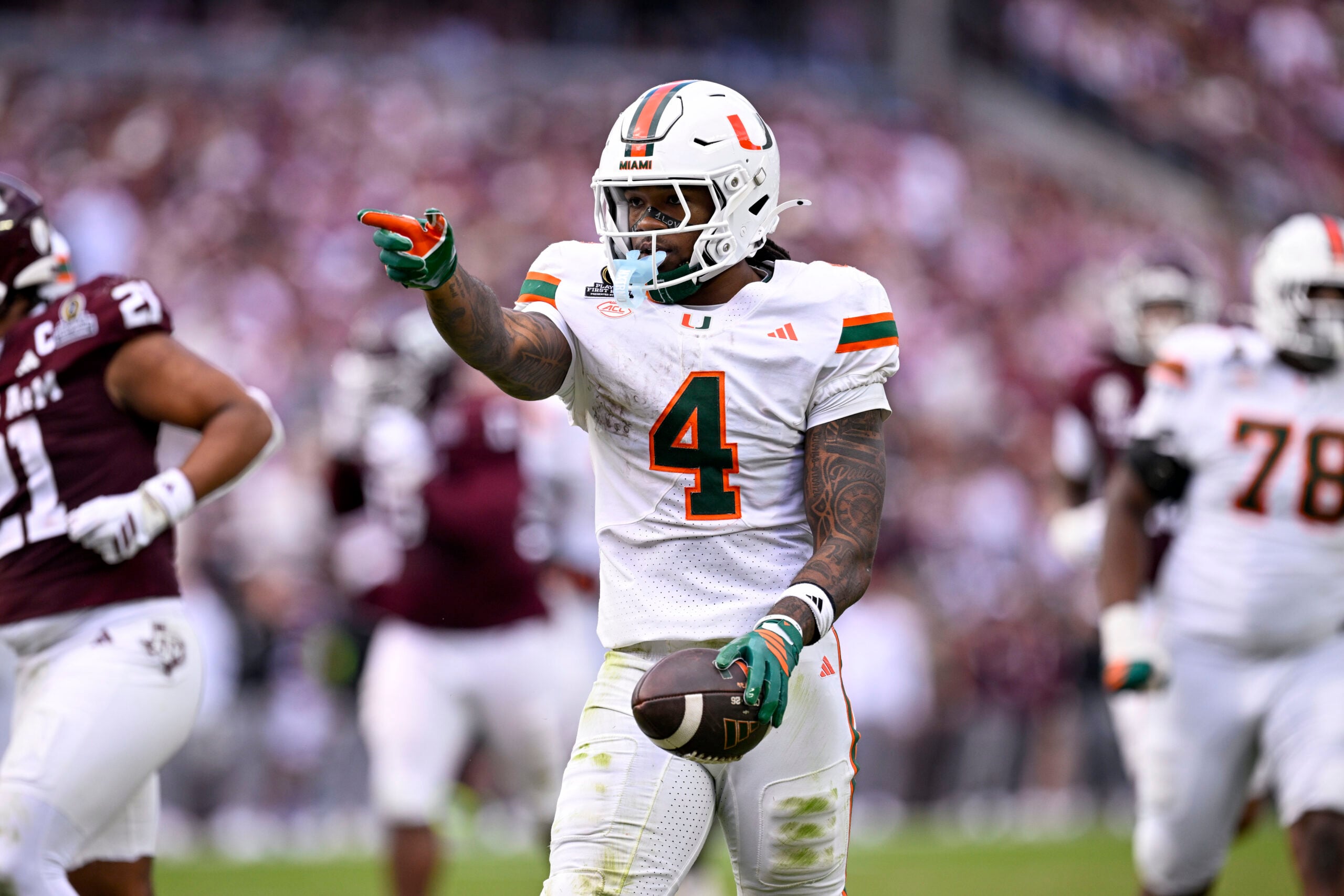Dec 20, 2025; College Station, TX, USA; Miami Hurricanes running back Mark Fletcher Jr. (4) celebrates during the game between the Aggies and the Hurricanes at Kyle Field. Mandatory Credit: Jerome Miron-Imagn Images