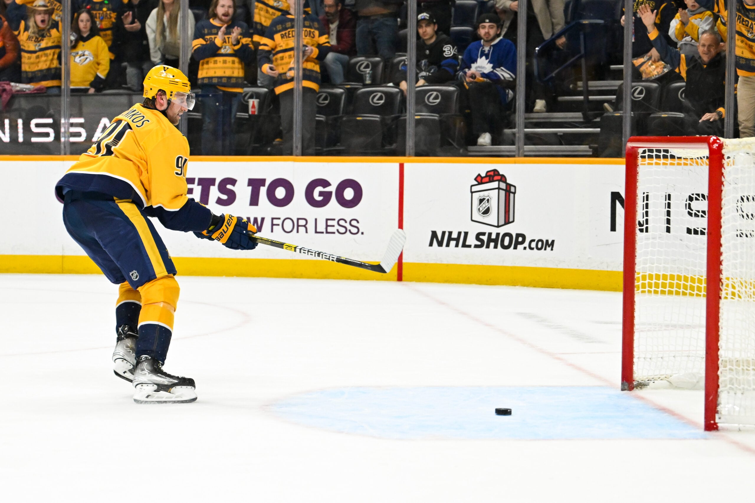 Dec 20, 2025; Nashville, Tennessee, USA;  Nashville Predators center Steven Stamkos (91) scores an empty net goal against the Toronto Maple Leafs during the third period at Bridgestone Arena. Mandatory Credit: Steve Roberts-Imagn Images