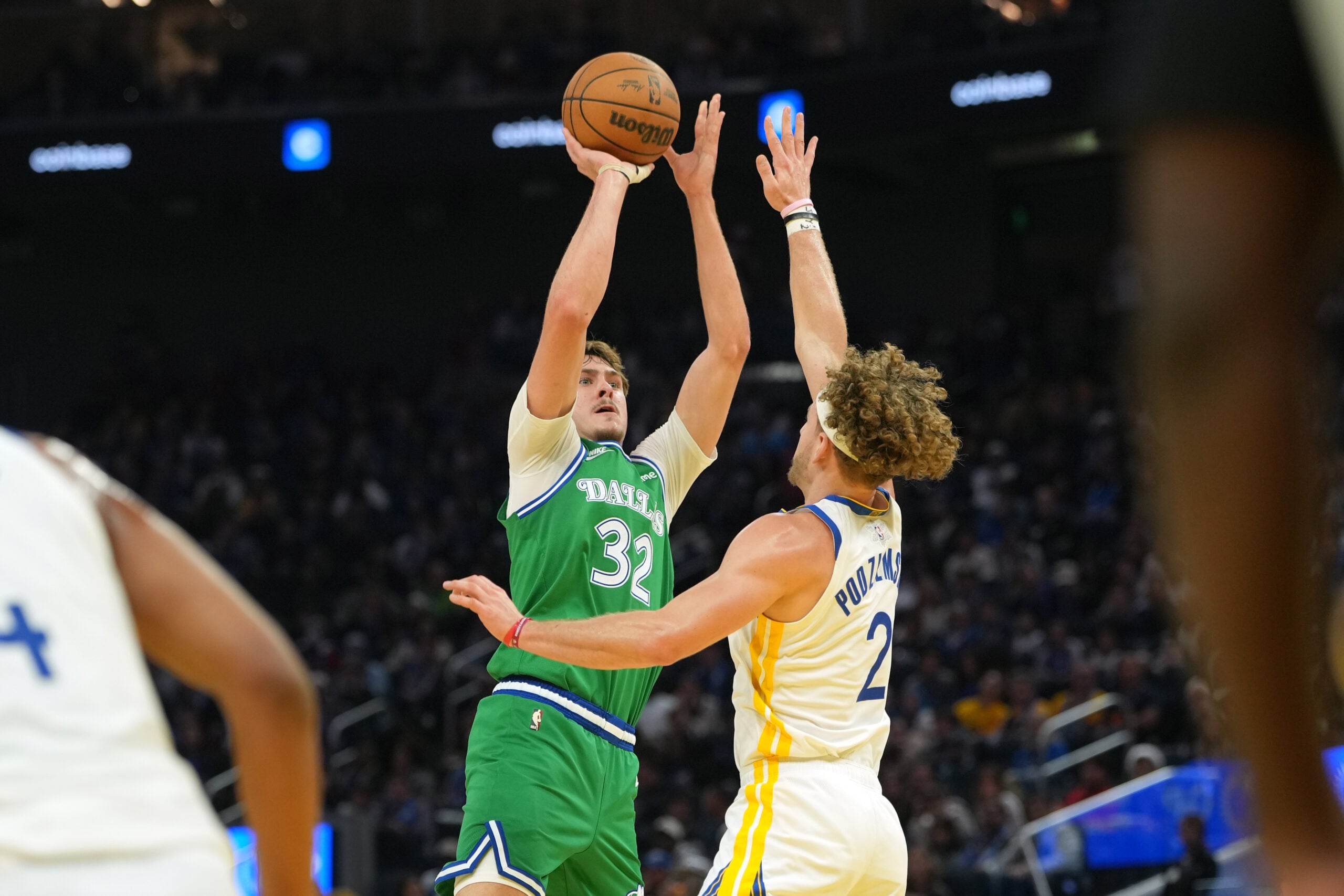Dec 25, 2025; San Francisco, California, USA; Dallas Mavericks forward Cooper Flagg (32) shoots against Golden State Warriors guard Brandin Podziemski (2) during the second quarter at Chase Center. Mandatory Credit: Darren Yamashita-Imagn Images