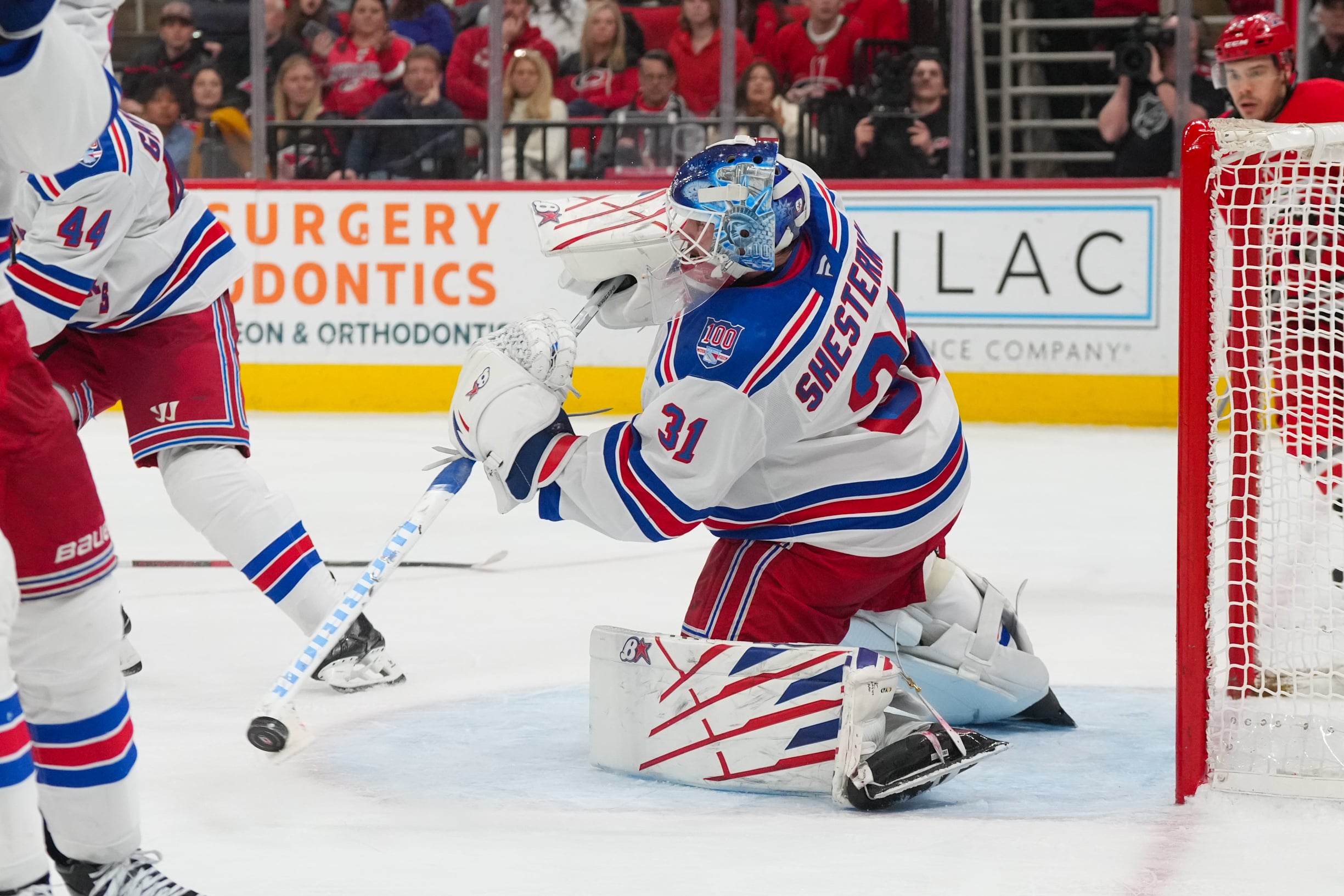 Dec 29, 2025; Raleigh, North Carolina, USA;  New York Rangers goaltender Igor Shesterkin (31) clears the puck away against the Carolina Hurricanes during the third period at Lenovo Center. Mandatory Credit: James Guillory-Imagn Images