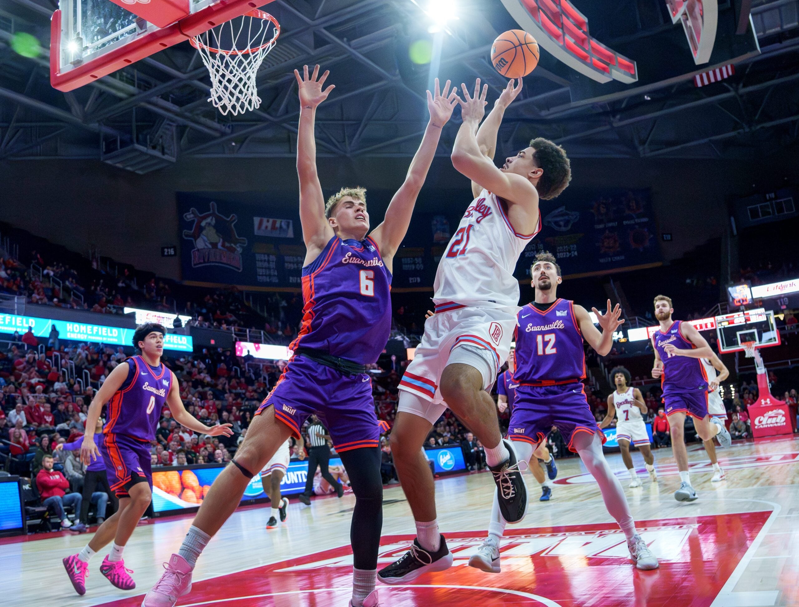 Bradley's AJ Smith puts up a shot over Evansville's Leif Moeller in the first half of their MVC college basketball game Monday, Dec. 29, 2025 at Carver Arena in Peoria. The Braves defeated the Aces 76-68.