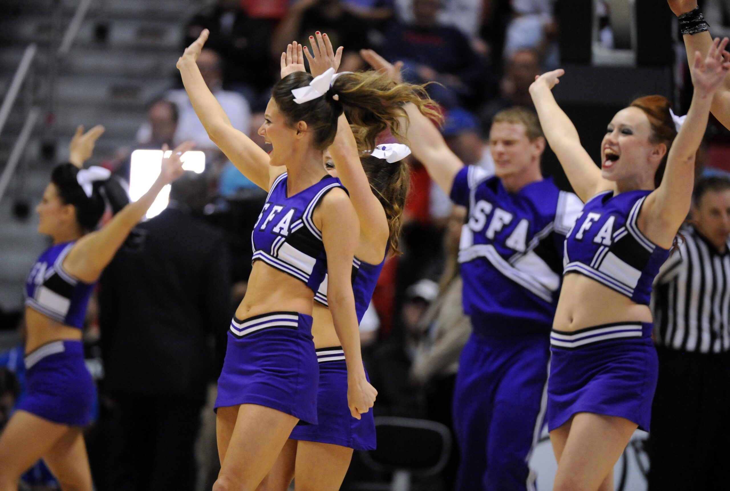 Mar 23, 2014; San Diego, CA, USA; Stephen F. Austin Lumberjacks cheerleaders perform in the first half of a men's college basketball game during the third round of the 2014 NCAA Tournament against the UCLA Bruins at Viejas Arena. Mandatory Credit: Christopher Hanewinckel-Imagn Images