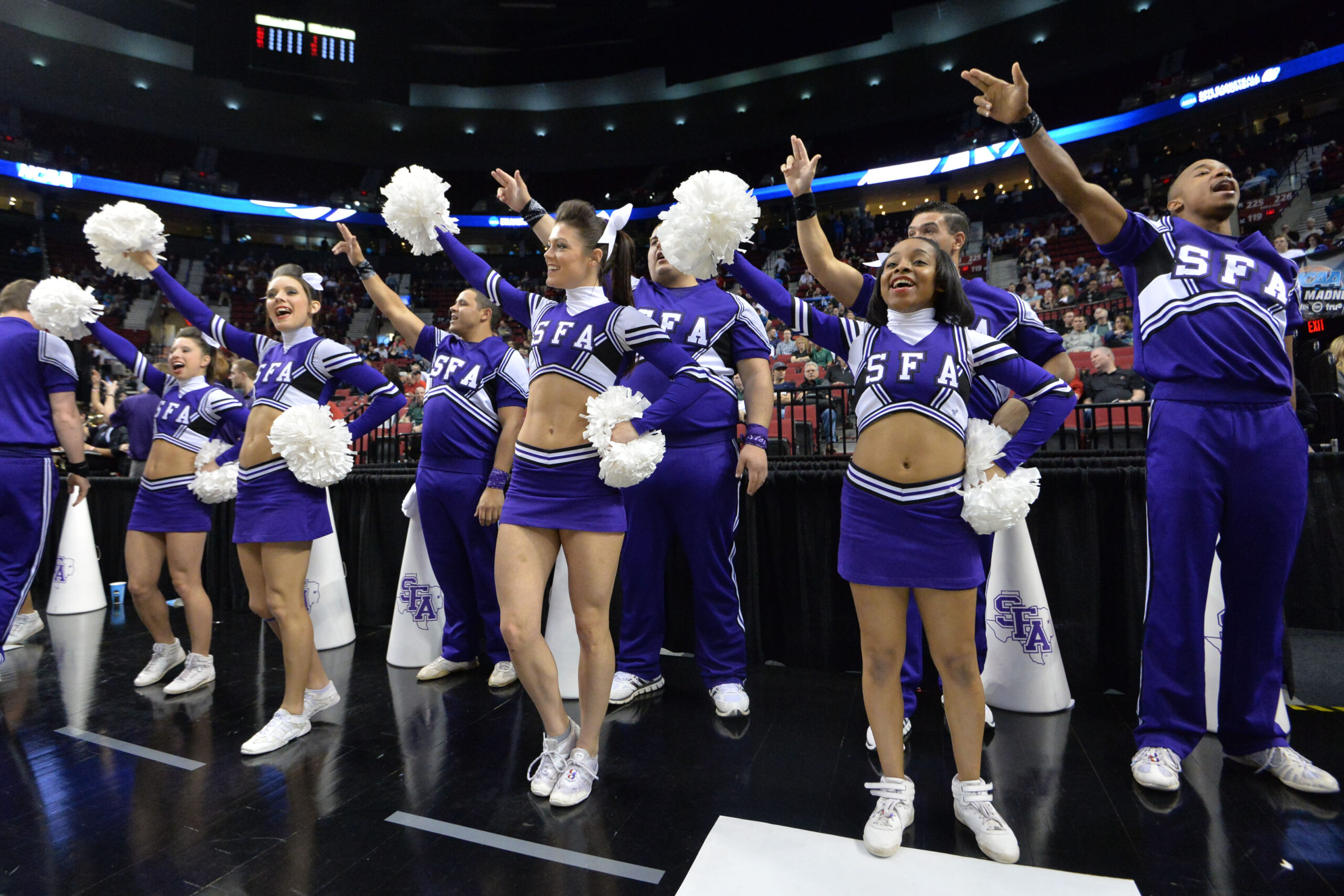 Mar 19, 2015; Portland, OR, USA; Stephen F. Austin Lumberjacks cheerleaders perform against the Utah Utes during the first half in the second round of the 2015 NCAA Tournament at Moda Center. Mandatory Credit: Kirby Lee-Imagn Images