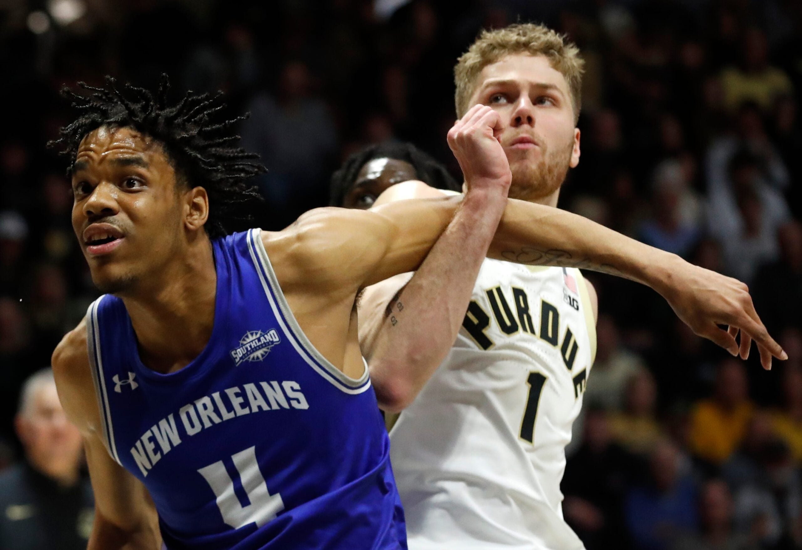 New Orleans Privateers forward Omarion Henry (4) boxes out Purdue Boilermakers forward Caleb Furst (1) during the NCAA men   s basketball game, Wednesday, Dec. 21, 2022, at Mackey Arena in West Lafayette, Ind. Purdue won 74-53.

Purduenombb122122 Am00807
