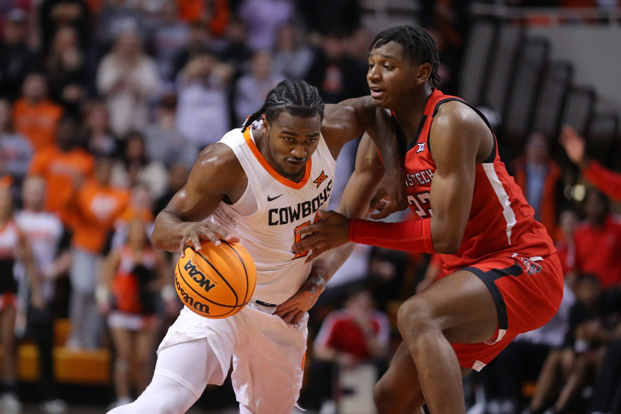 Oklahoma State Cowboys guard John-Michael Wright (51) is fouled by Texas Tech Red Raiders guard Elijah Fisher (22) during a men's college basketball game between the Oklahoma State University Cowboys (OSU) and the Texas Tech Red Raiders at Gallagher-Iba Arena in Stillwater, Okla., Wednesday, Feb. 8, 2023. Oklahoma State won 71-68.

Osu Vs Texas Tech Men S Basketball