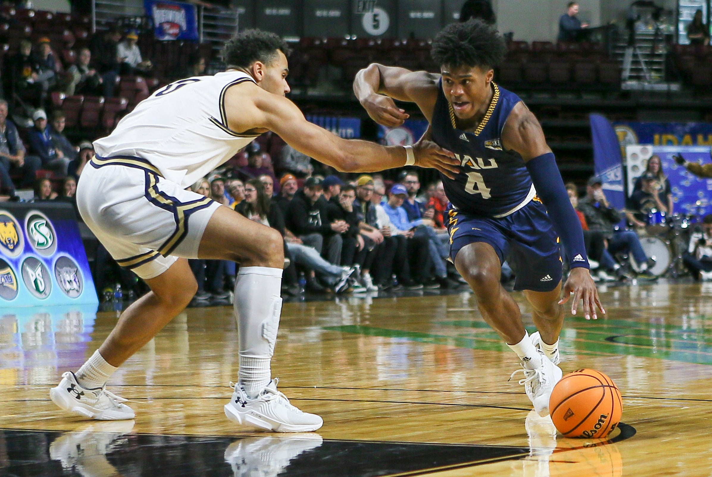 Mar 8, 2023; Boise, ID, USA; Northern Arizona Lumberjacks guard Oakland Fort (4) drives during the second half against Montana State Bobcats at Idaho Central Arena. Montana State defeated Northern Arizona 85-78. Mandatory Credit: Brian Losness-Imagn Images
