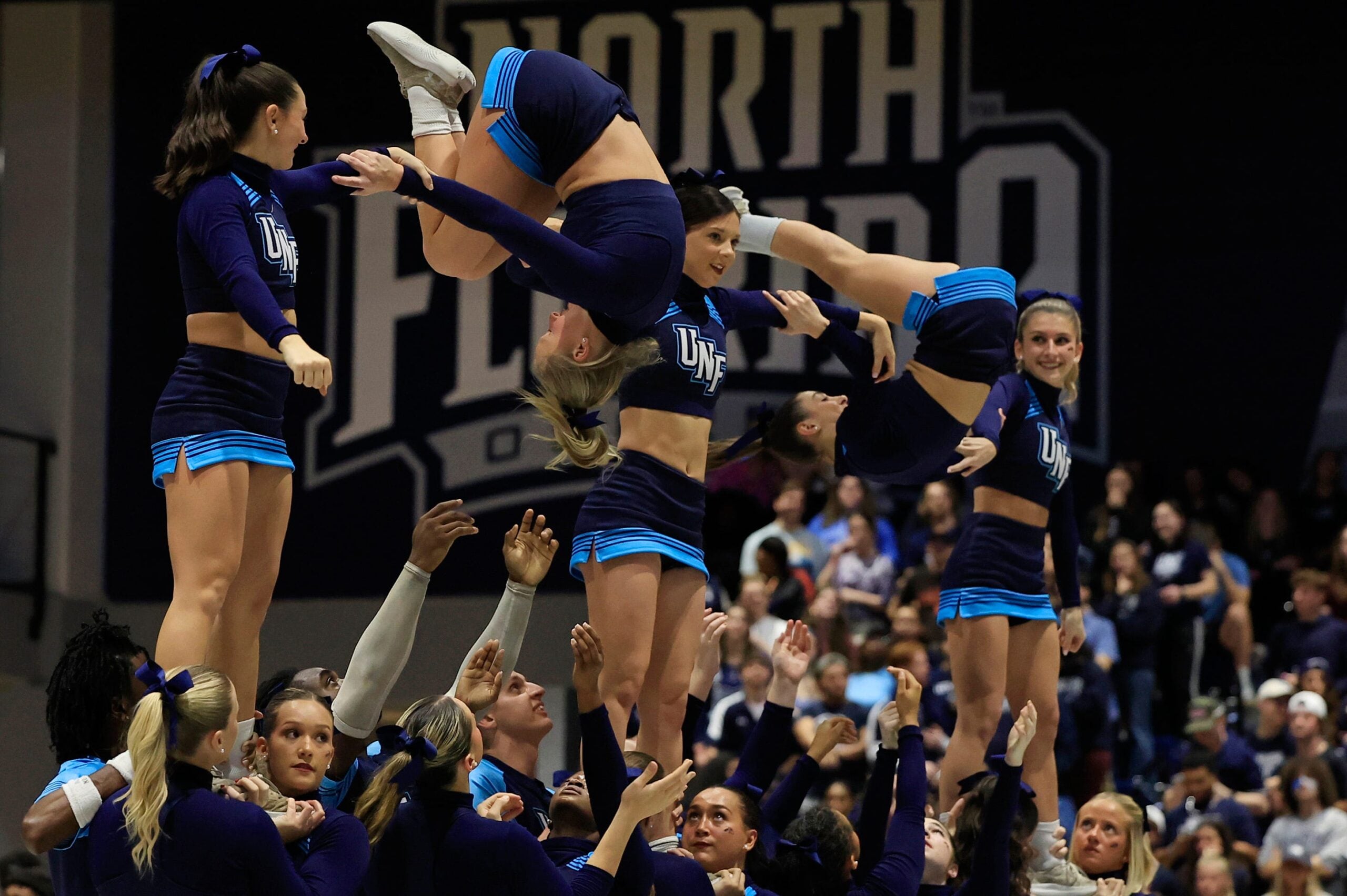 North Florida Ospreys cheerleaders perform during the second half of an NCAA men   s basketball game Friday, Jan. 12, 2024 at the University of North Florida   s UNF Arena in Jacksonville, Fla. UNF defeated JU 82-74. [Corey Perrine/Florida Times-Union]