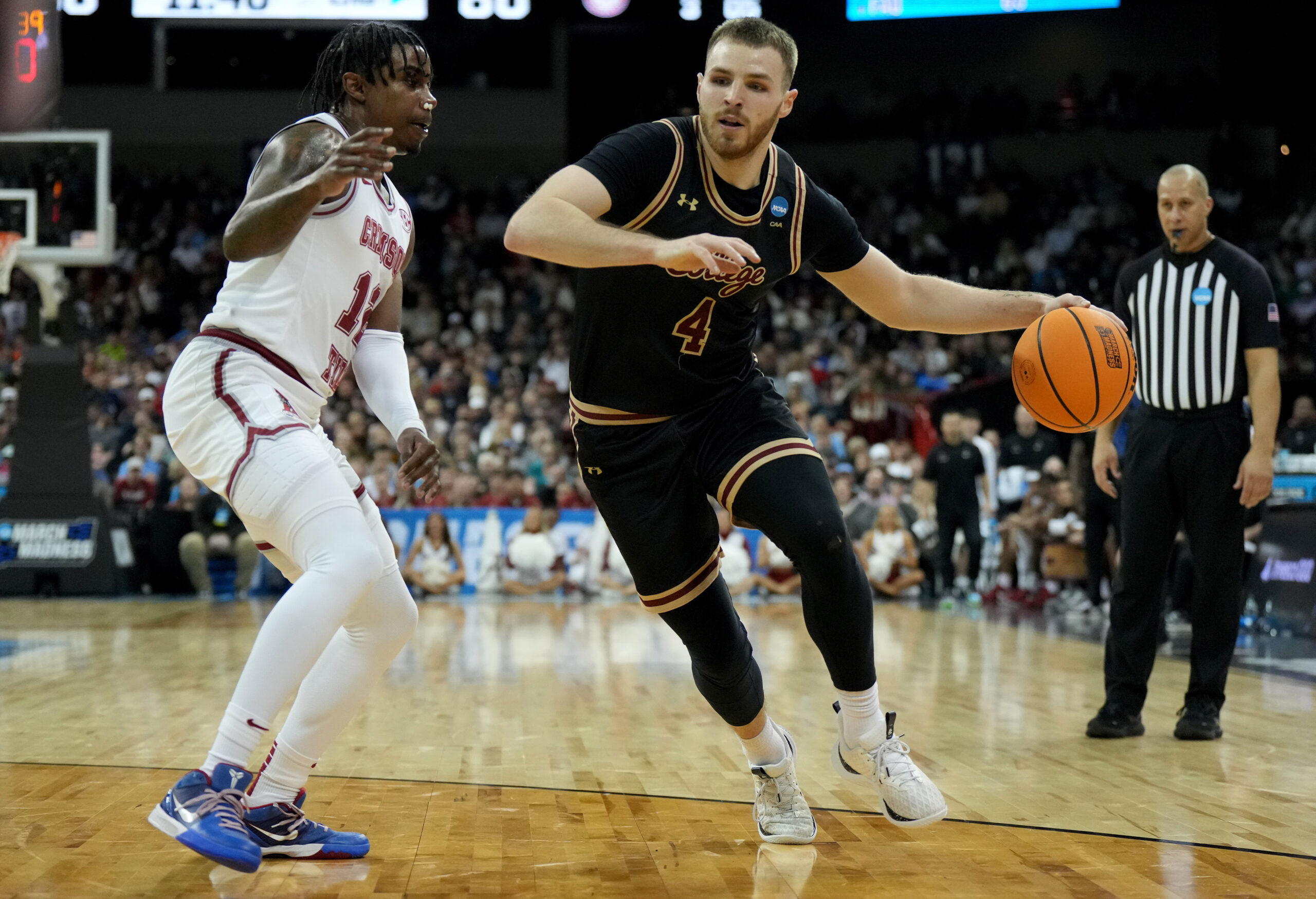 Mar 22, 2024; Spokane, WA, USA; Charleston Cougars guard Bryce Butler (4) dribbles against Alabama Crimson Tide guard Latrell Wrightsell Jr. (12) during the second half in the first round of the 2024 NCAA Tournament at Spokane Veterans Memorial Arena. Mandatory Credit: Kirby Lee-Imagn Images