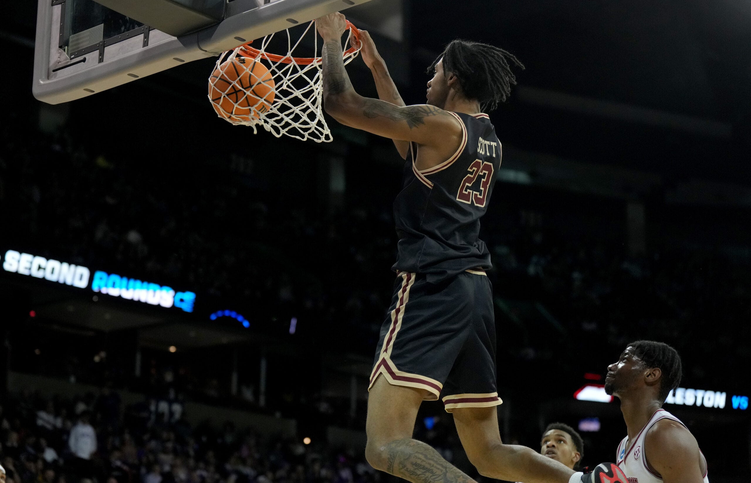 Mar 22, 2024; Spokane, WA, USA; Charleston Cougars forward James Scott (23) dunks during the second half in the first round of the 2024 NCAA Tournament against the Alabama Crimson Tide at Spokane Veterans Memorial Arena. Mandatory Credit: Kirby Lee-Imagn Images