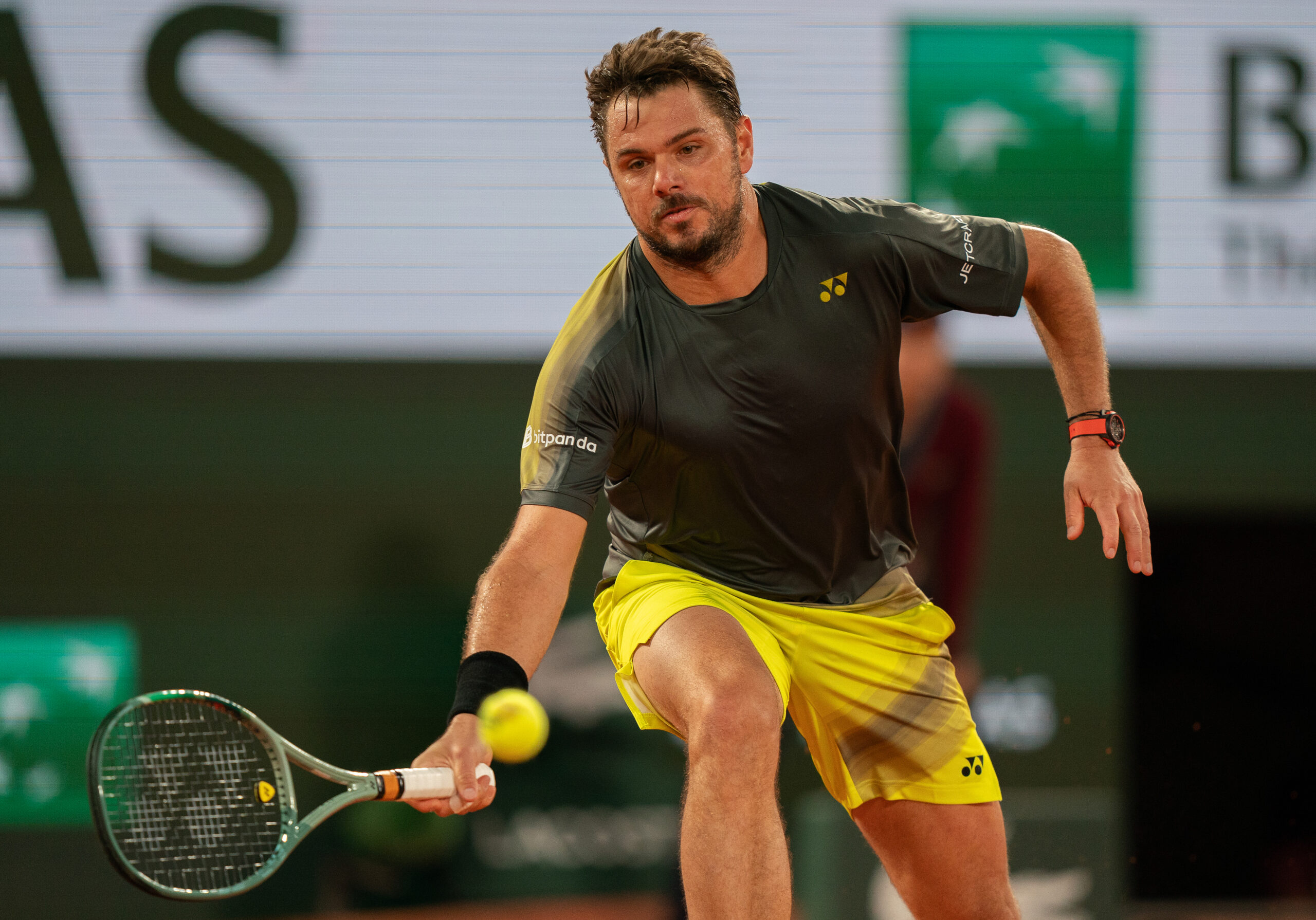 May 26, 2024; Paris, France; Stan Wawrinka of Switzerland returns a shot during his match against Andy Murray of Great Britain on day one of Roland Garros at Stade Roland Garros. Mandatory Credit: Susan Mullane-Imagn Images