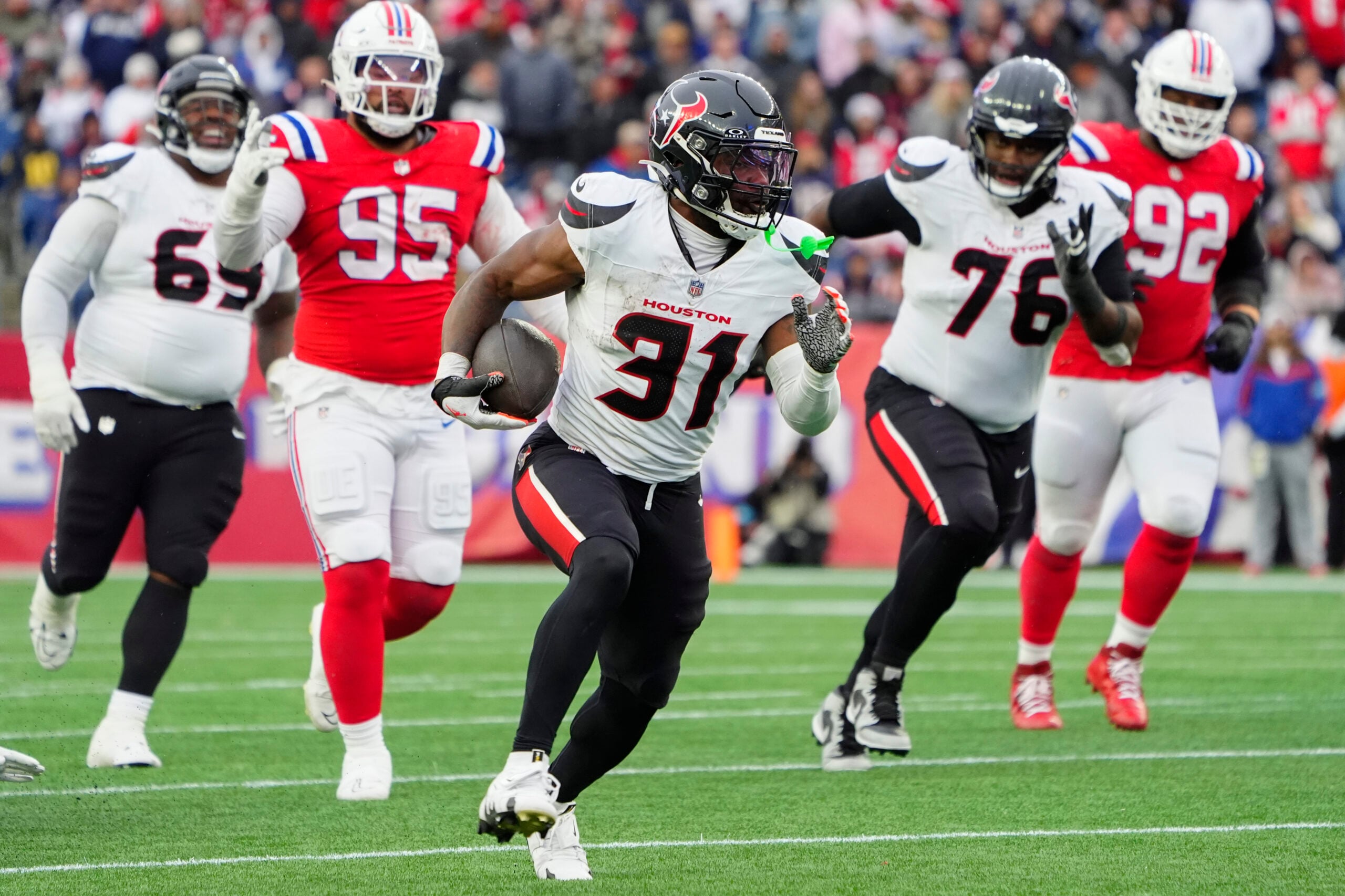Oct 13, 2024; Foxborough, Massachusetts, USA; Houston Texans running back Dameon Pierce (31) runs with the ball for a touchdown against the New England Patriots during the second half at Gillette Stadium. Mandatory Credit: Gregory Fisher-Imagn Images