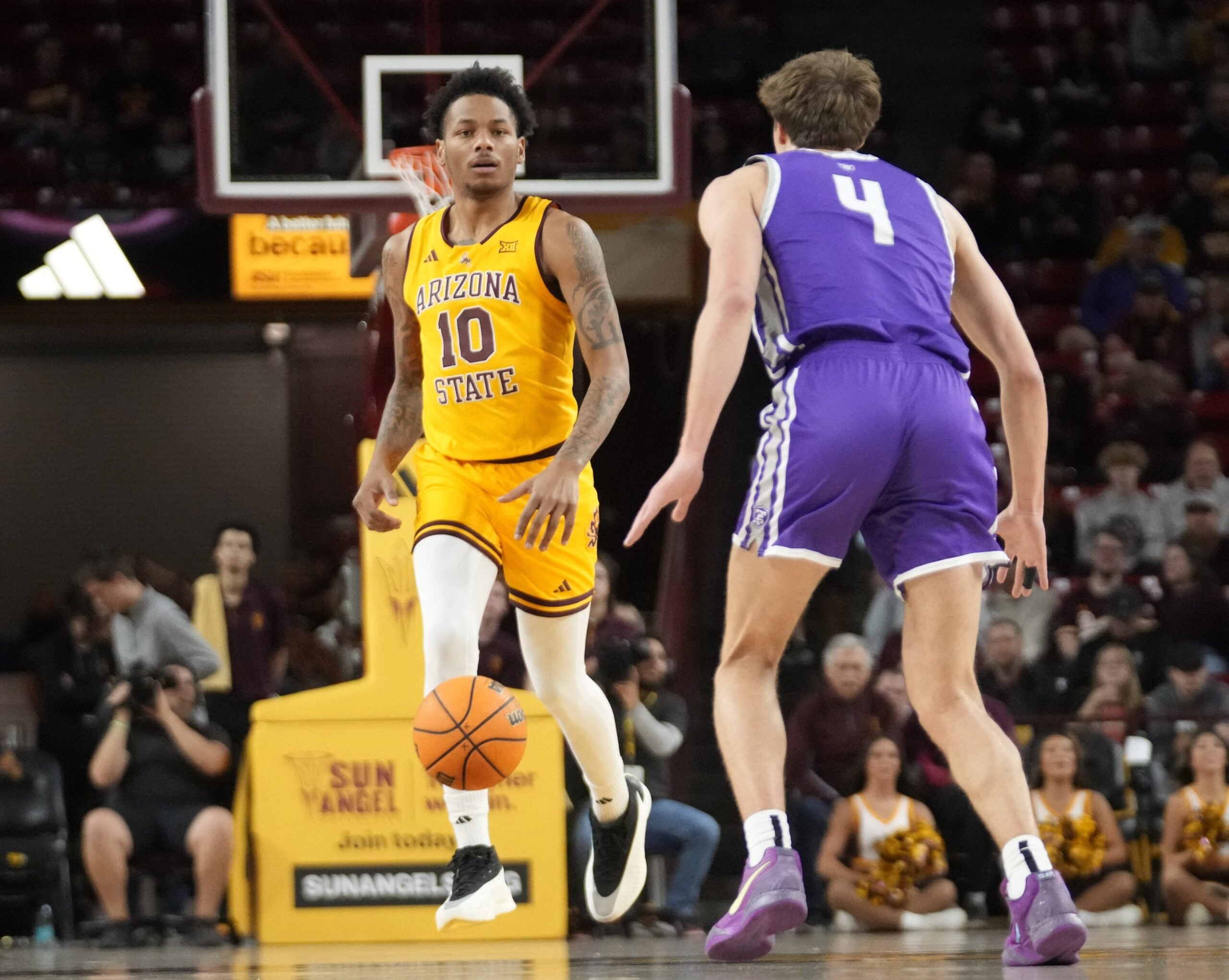 Nov 17, 2024; Tempe, Ariz., U.S.; Arizona State guard BJ Freeman (10) brings the ball up against St. Thomas guard Nolan Minessale (4) during the first half at Desert Financial Arena. Mandatory Credit: Michael Chow-Arizona Republic