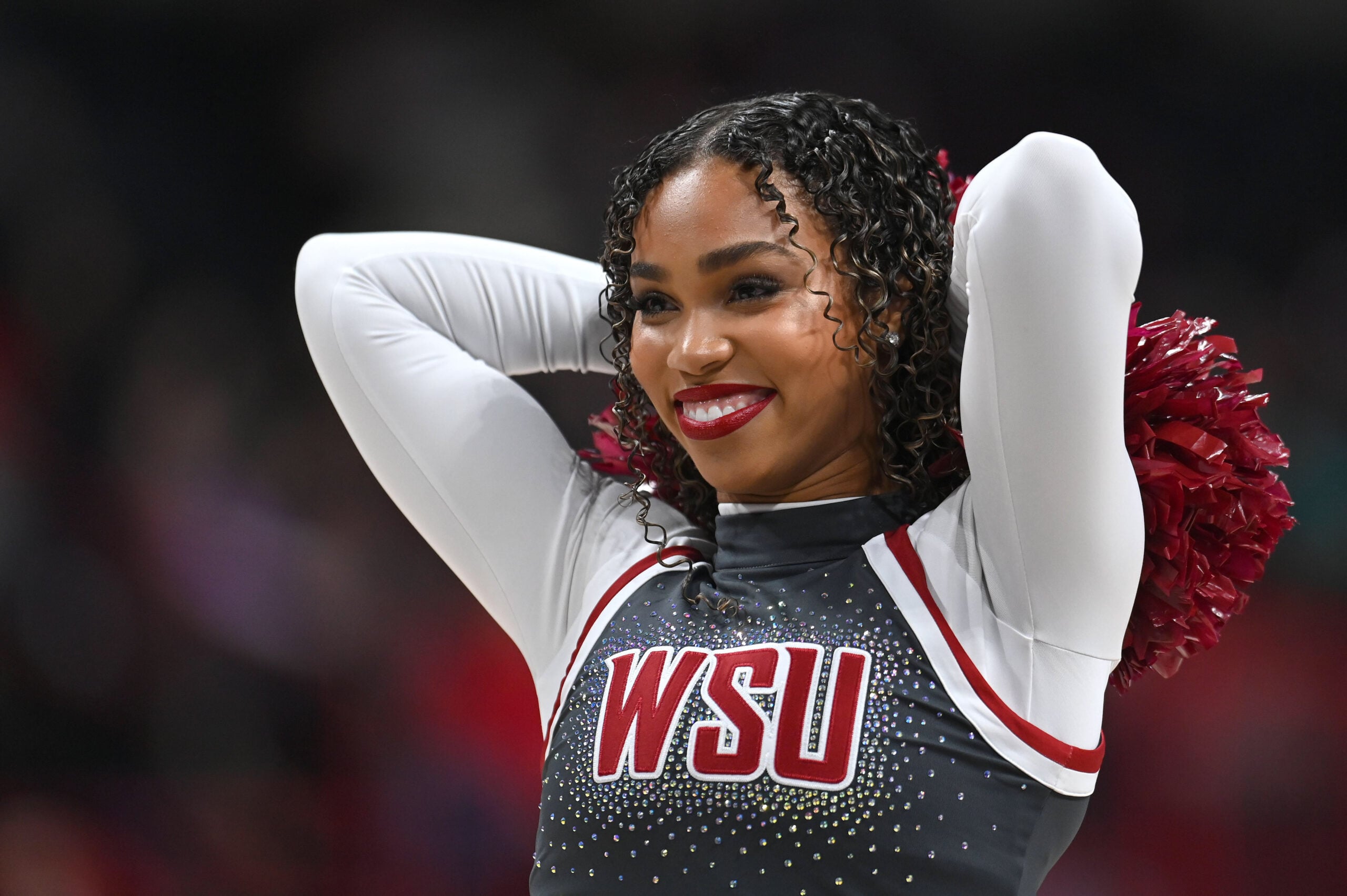 Nov 21, 2024; Spokane, Washington, USA; Washington State Cougars cheerleader performs against the Eastern Washington Eagles in the second half at Spokane Veterans Memorial Arena. Mandatory Credit: James Snook-Imagn Images