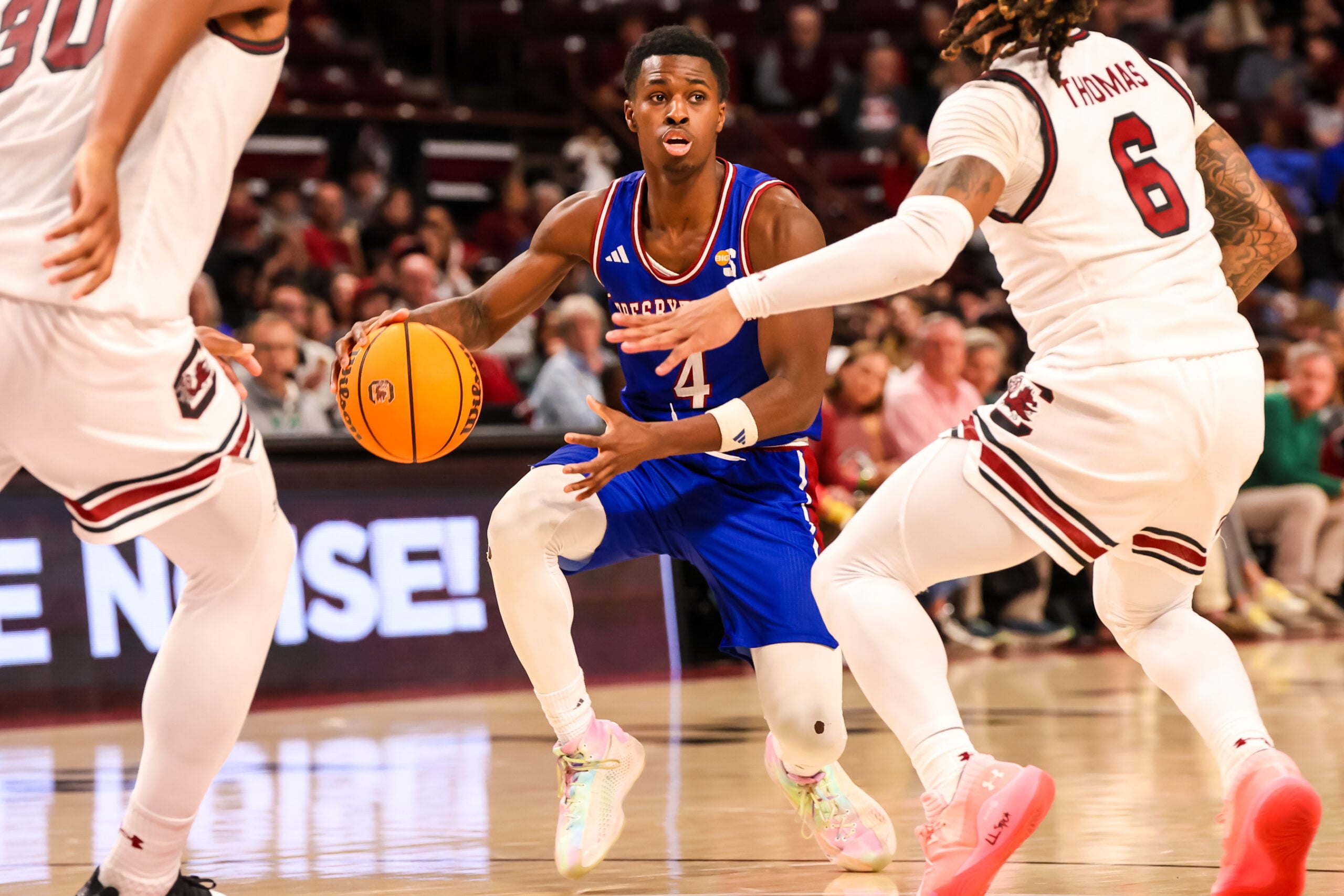 Dec 30, 2024; Columbia, South Carolina, USA; Presbyterian Blue Hose guard Kory Mincy (4) drives against the South Carolina Gamecocks in the second half at Colonial Life Arena. Mandatory Credit: Jeff Blake-Imagn Images