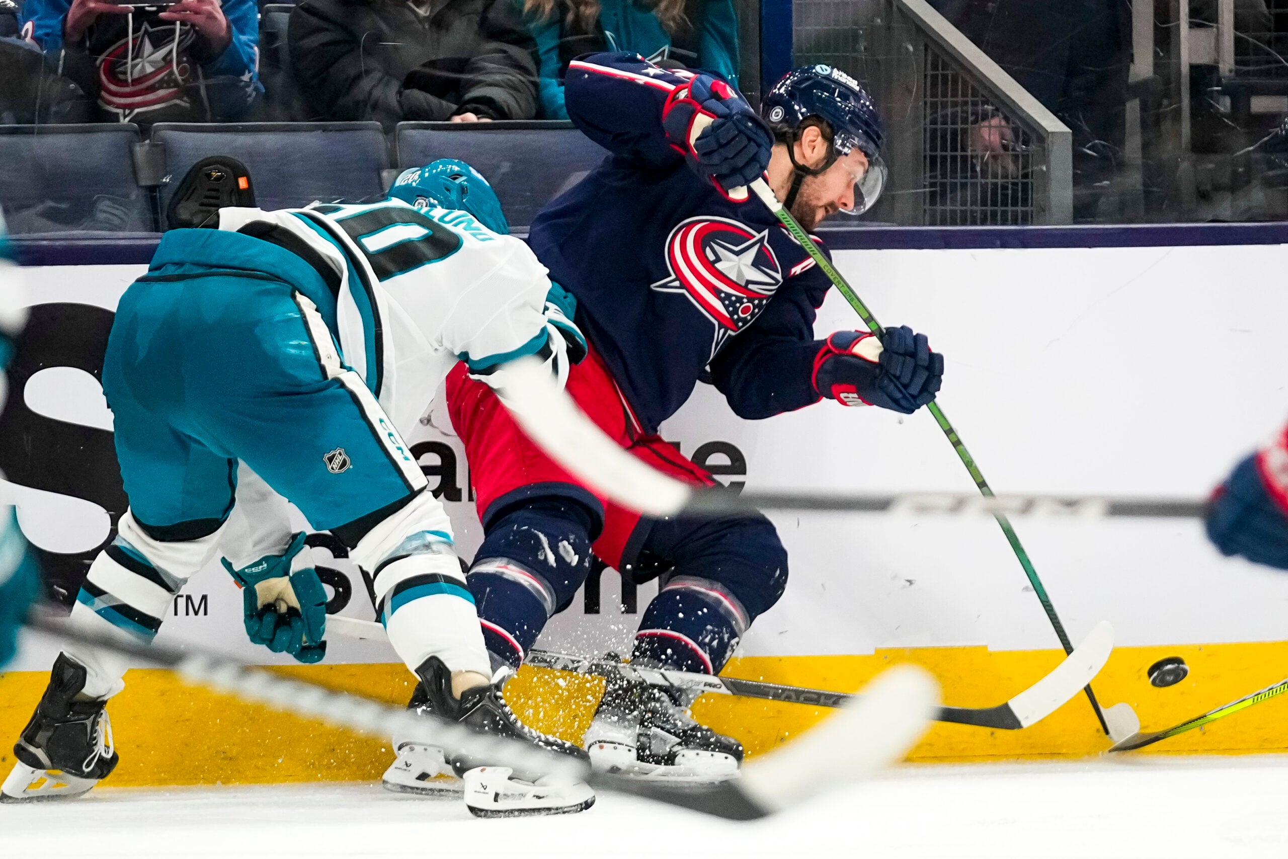 Jan 16, 2025; Columbus, Ohio, USA; Columbus Blue Jackets center Sean Kuraly (7) fights for the puck against the San Jose Sharks in the third period at Nationwide Arena on Thursday, Jan. 16, 2025 in Columbus, Ohio.   Mandatory Credit: Samantha Madar/USA TODAY Network via Imagn Images