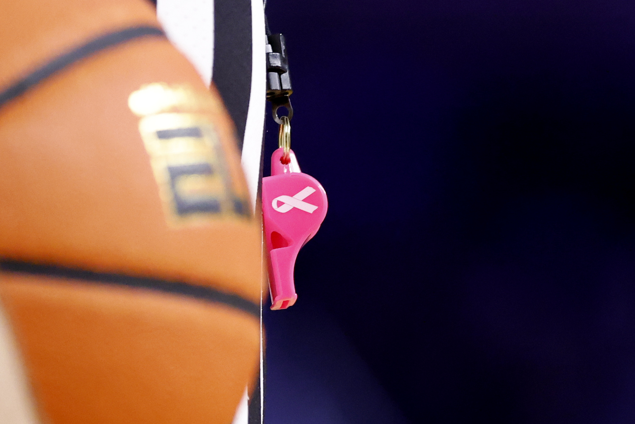 Jan 27, 2025; Ann Arbor, Michigan, USA; Referees use pink whistles during the game between the Michigan Wolverines and the Penn State Nittany Lions at Crisler Center. Mandatory Credit: Rick Osentoski-Imagn Images