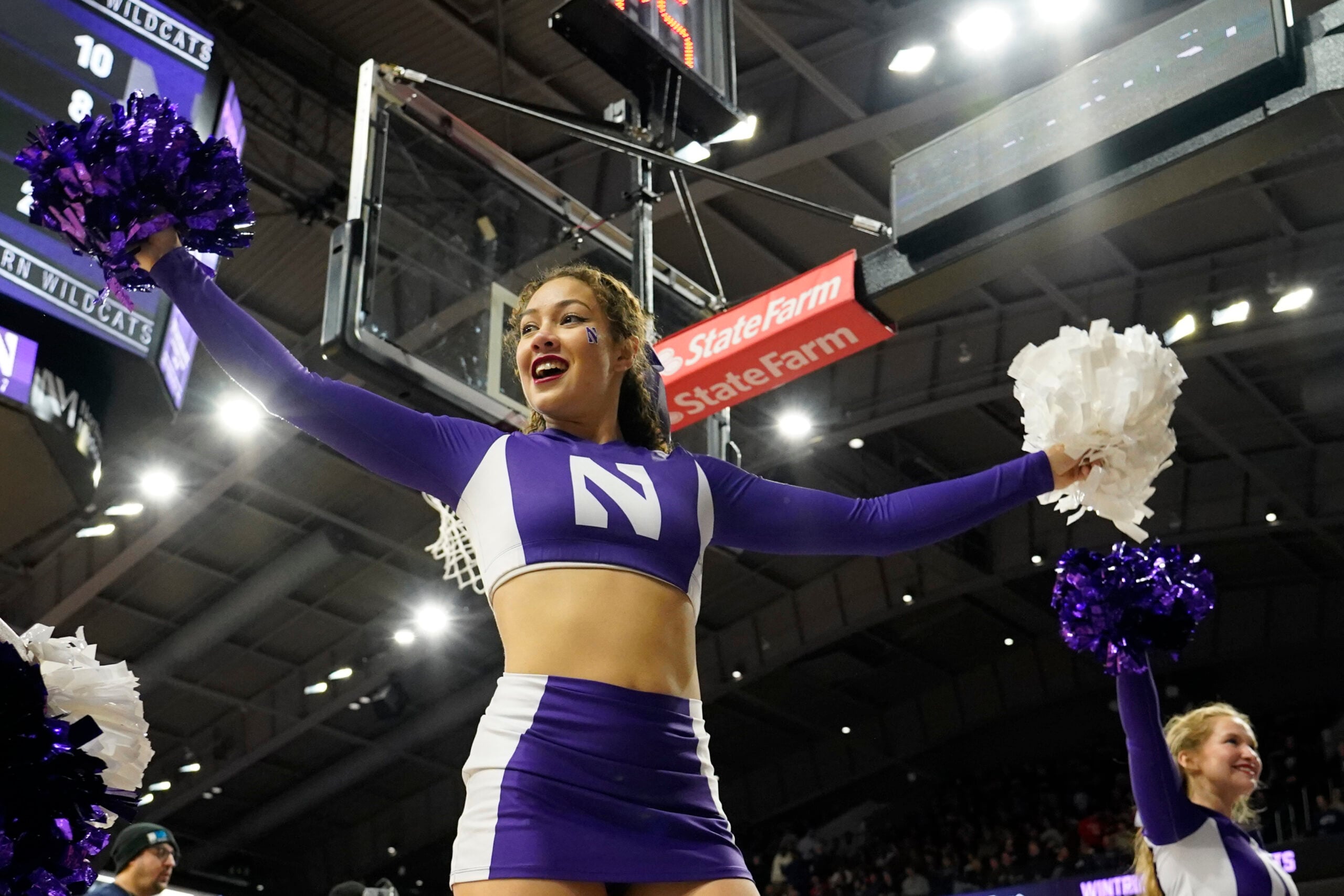 Feb 16, 2025; Evanston, Illinois, USA; A Northwestern Wildcats cheerleader performs during the second half at Welsh-Ryan Arena. Mandatory Credit: David Banks-Imagn Images