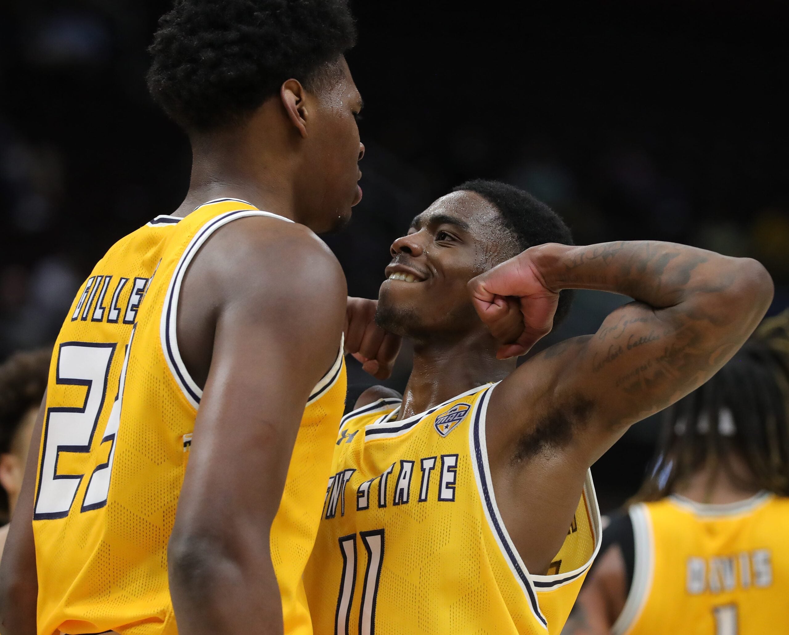 Kent State Golden Flashes guard Cian Medley (11) celebrates with forward Delrecco Gillespie (23) during the second half of an NCAA college basketball game in the semifinals of the Mid-American Conference Tournament at Rocket Arena on Friday, March 14, 2025, in Cleveland, Ohio.