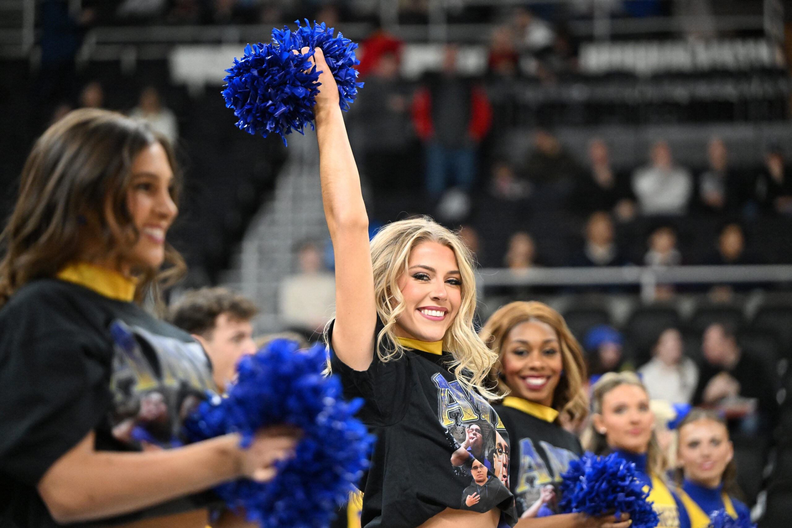 Mar 22, 2025; Providence, RI, USA; McNeese State Cowboys cheerleaders wear shirts with McNeese State Cowboys manager Amir Khan (not pictured) before a second round men’s NCAA Tournament game against the Purdue Boilermakers at Amica Mutual Pavilion. Mandatory Credit: Brian Fluharty-Imagn Images