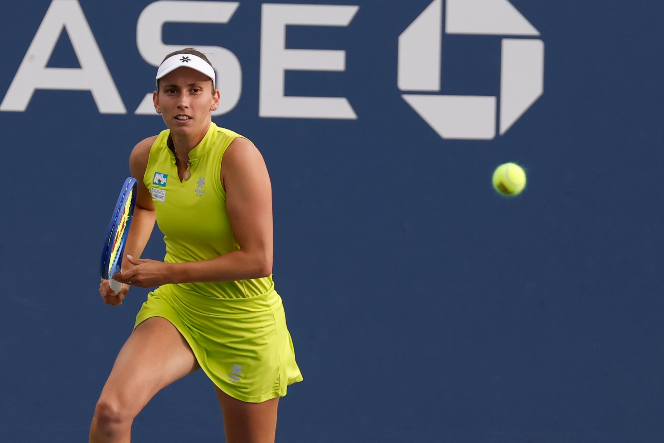 Aug 27, 2025; Flushing, NY, USA; Elise Mertens (BEL) chases a shot against Lulu Sun (NZL) (not pictured) on day four of the 2025 US Open tennis tournament at Billie Jean King USTA National Tennis Center. Mandatory Credit: Geoff Burke-Imagn Images