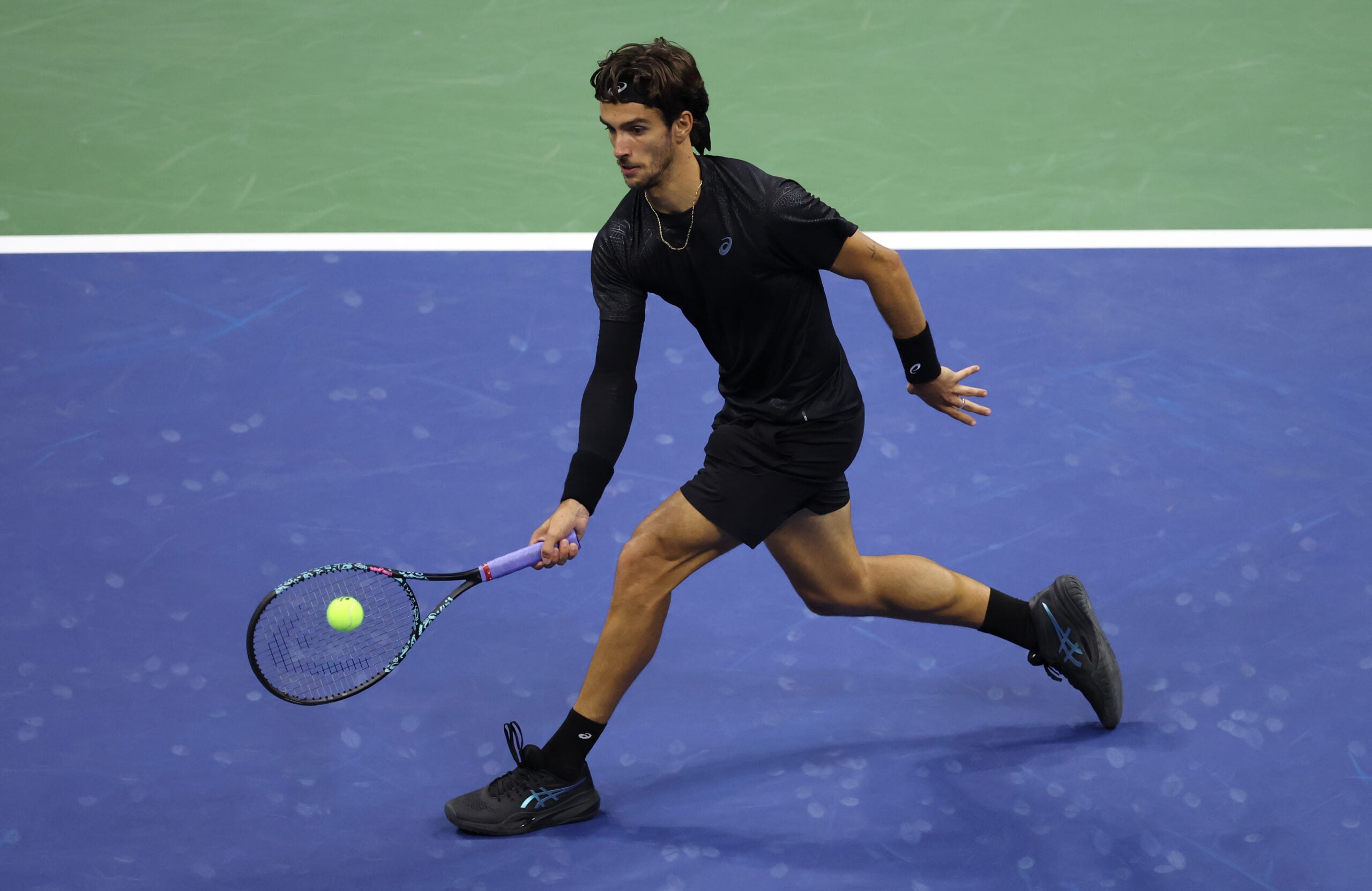 Sep 3, 2025; Flushing, NY, USA; Lorenzo Musetti (ITA) hits a shot against Jannik Sinner (ITA) (not pictured) on day eleven of the 2025 US Open tennis championships at USTA Billie Jean King National Tennis Center. Mandatory Credit: Mike Frey-Imagn Images