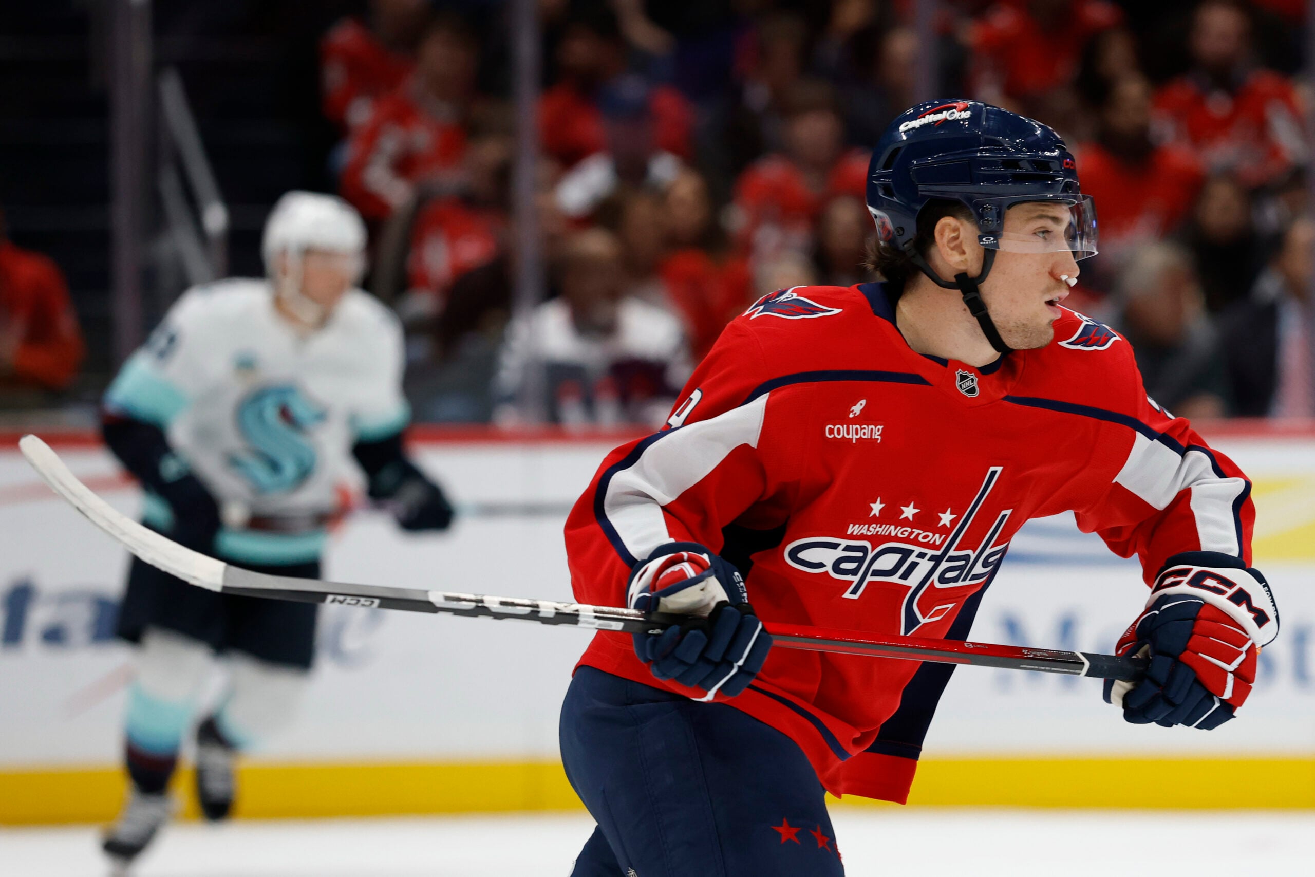 Oct 21, 2025; Washington, District of Columbia, USA; Washington Capitals right wing Ryan Leonard (9) skates with nose plugs after taking a stick to the face against the Seattle Kraken during the first period at Capital One Arena. Mandatory Credit: Geoff Burke-Imagn Images