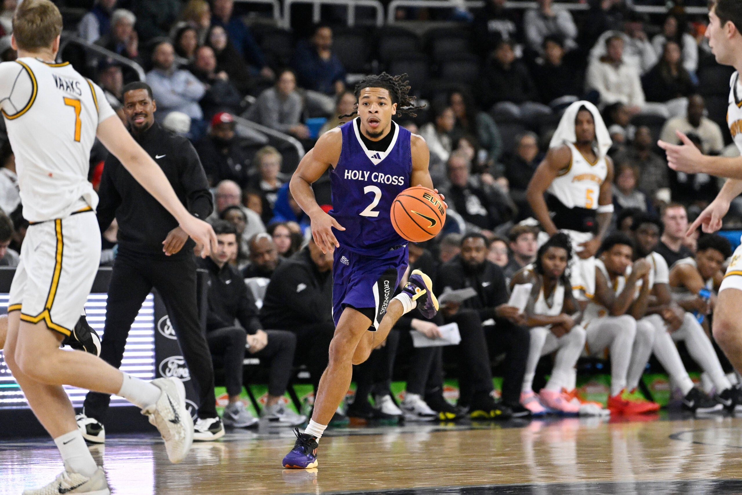 Nov 3, 2025; Providence, Rhode Island, USA; Holy Cross Crusaders guard Deandre Williams (2) dribbles the ball during the second half against the Providence Friars at Amica Mutual Pavilion. Mandatory Credit: Eric Canha-Imagn Images