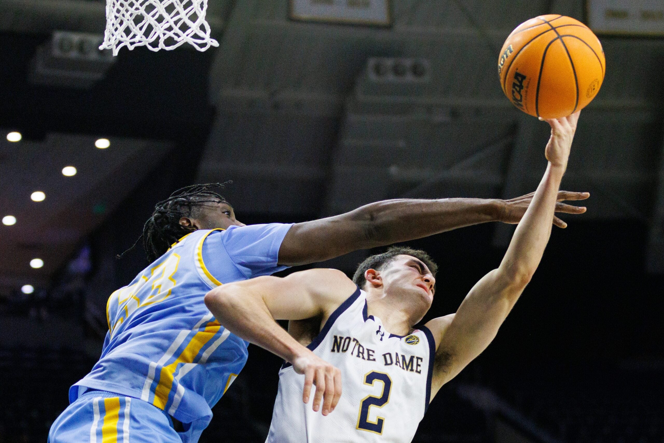 LIU forward Jamal Fuller, left, fouls Notre Dame guard Logan Imes (2) during a NCAA basketball game at Purcell Pavilion on Monday, Nov. 3, 2025, in South Bend.