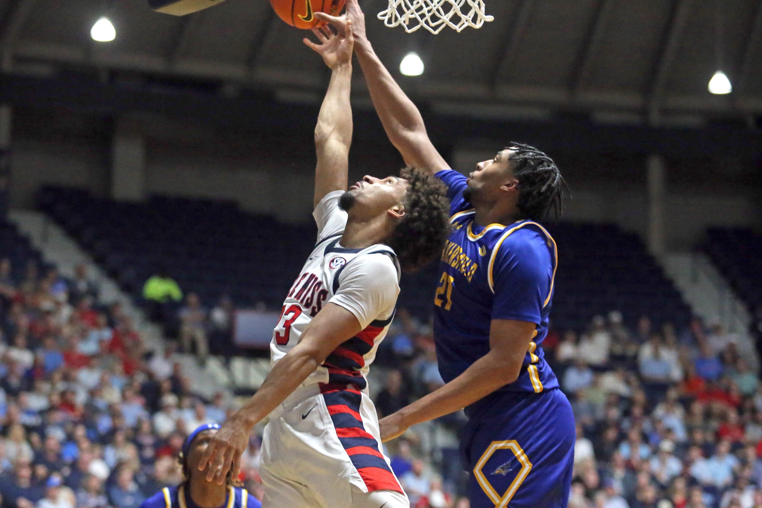 Nov 14, 2025; Oxford, Mississippi, USA; Mississippi Rebels guard Patton Pinkins (23) shoots as Cal State Bakersfield Roadrunners forward Ronald Jessamy (21) defends during the second half at C.M. ’Tad’ Smith Coliseum. Mandatory Credit: Petre Thomas-Imagn Images
