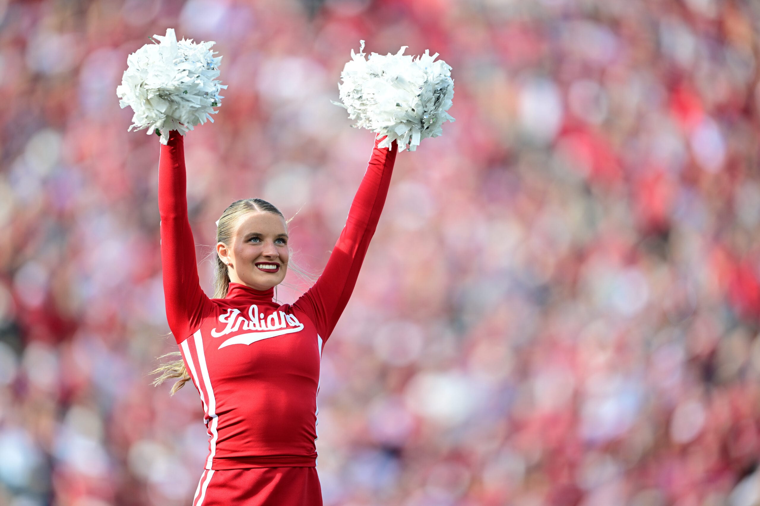 Nov 15, 2025; Bloomington, Indiana, USA; A Indiana Hoosiers cheerleader performs during a timeout in during the second quarter of the game against the Wisconsin Badgers at Memorial Stadium. Mandatory Credit: Marc Lebryk-Imagn Images