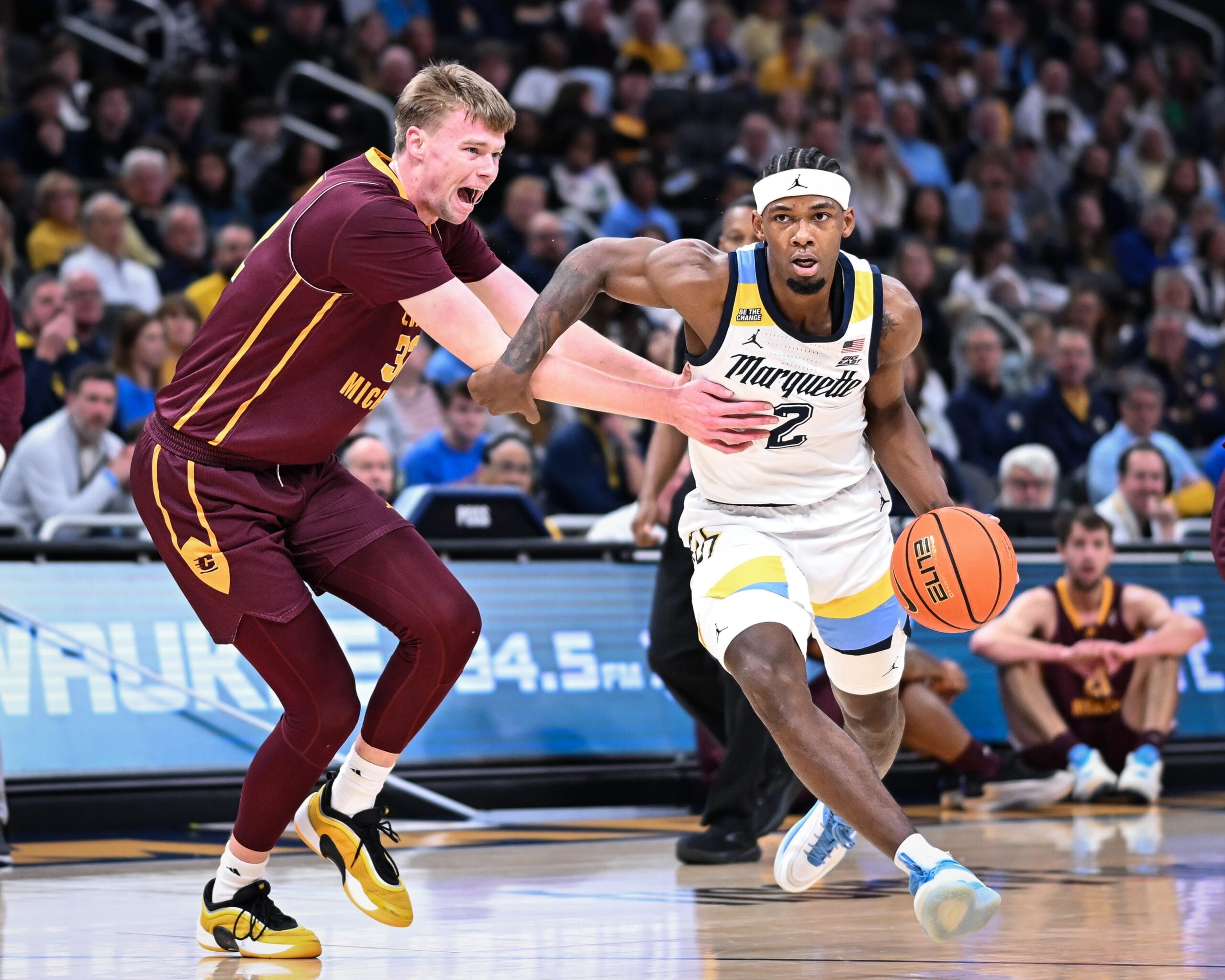 Marquette guard Chase Ross (2) goes to the basket past Central Michigan center Nathan Claerbaut (32) in the first half of a game Saturday, November 22, 2025, at Fiserv Forum in Milwaukee, Wisconsin.