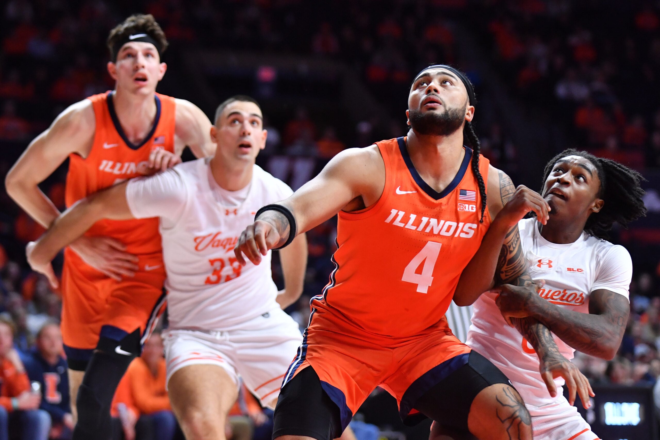 Nov 24, 2025; Champaign, Illinois, USA;  Illinois Fighting Illini guard Kylan Boswell (4) and UT Rio Grande Valley Vaqueros guard Jaylen Washington (0) wrestle for position under the basket during the first half at State Farm Center. Mandatory Credit: Ron Johnson-Imagn Images