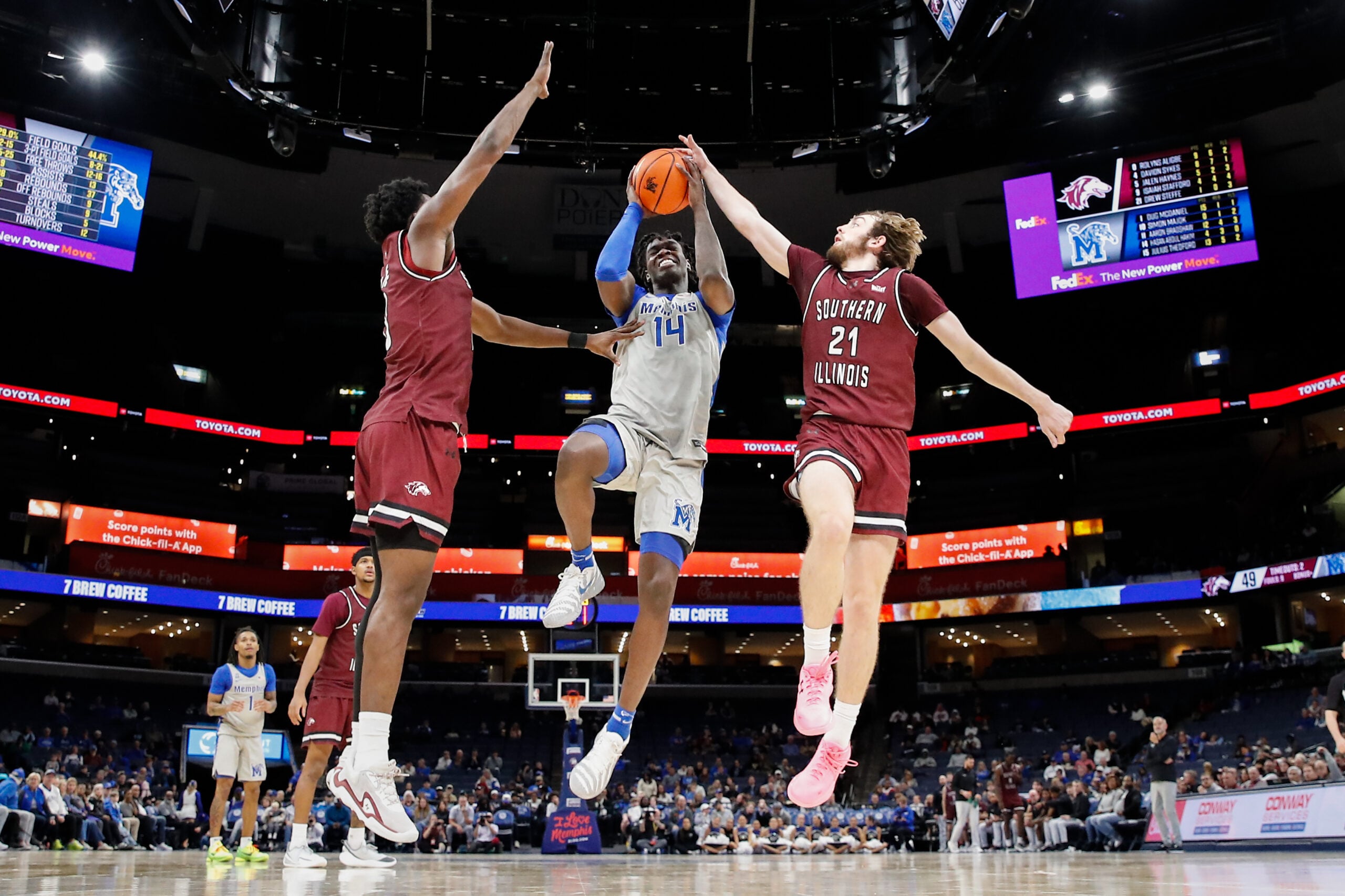 Nov 26, 2025; Memphis, Tennessee, USA; Memphis Tigers guard Hasan Abdul Hakim (14) shoots the ball against Southern Illinois Salukis guard Drew Steffe (21) during the second half at FedExForum. Mandatory Credit: Wesley Hale-Imagn Images