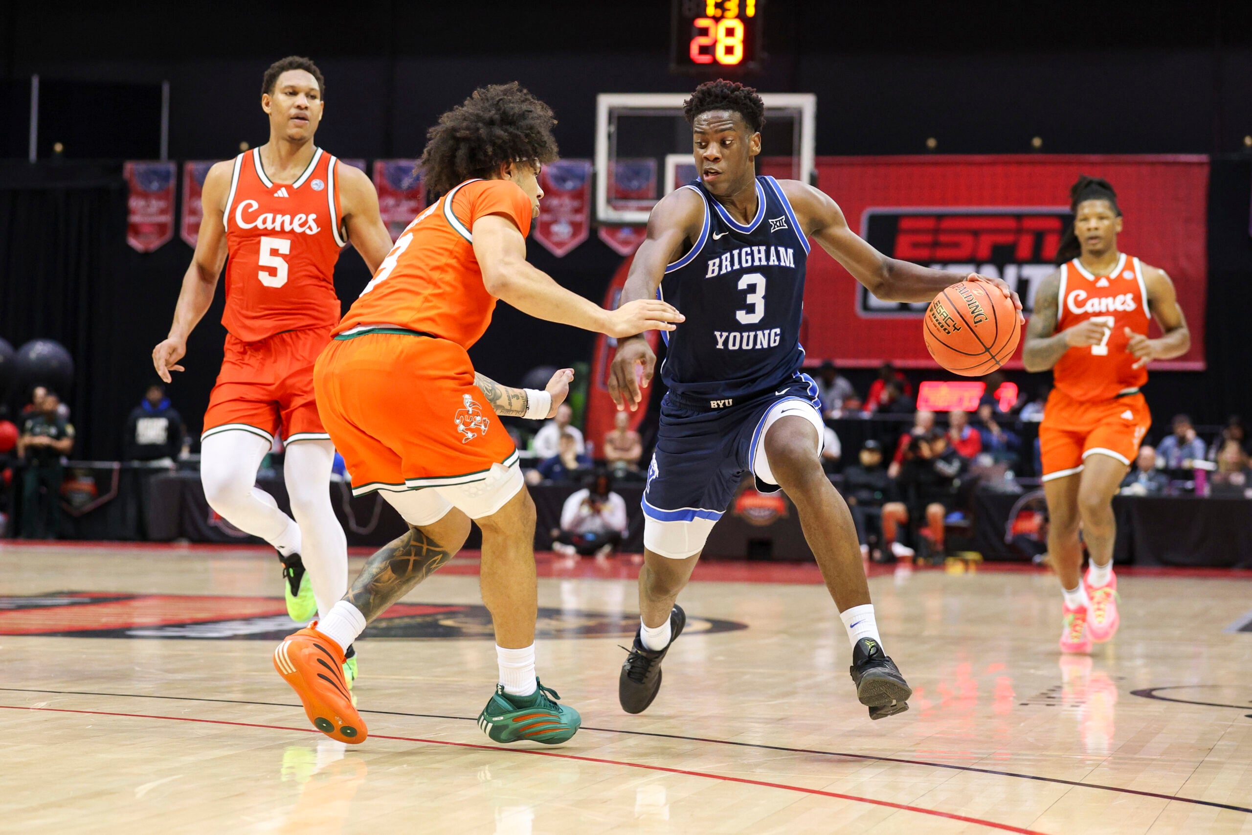 Nov 27, 2025; Kissimmee, Florida, USA; Brigham Young University Cougars forward AJ Dybantsa (3) drives to the hoop against the Miami (FL) Hurricanes in the second half at State Farm Field House. Mandatory Credit: Nathan Ray Seebeck-Imagn Images
