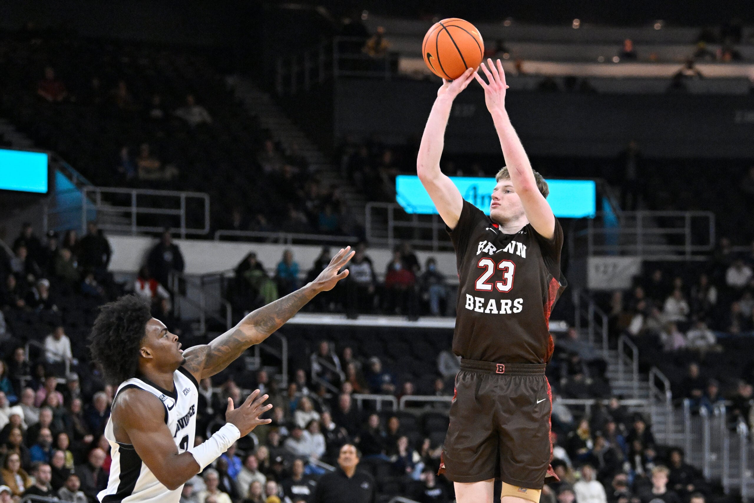 Dec 9, 2025; Providence, Rhode Island, USA; Brown Bears guard David Rochester (23) shoots the ball over Providence Friars guard Jaylin Sellers (2) during the second half at Amica Mutual Pavilion. Mandatory Credit: Eric Canha-Imagn Images