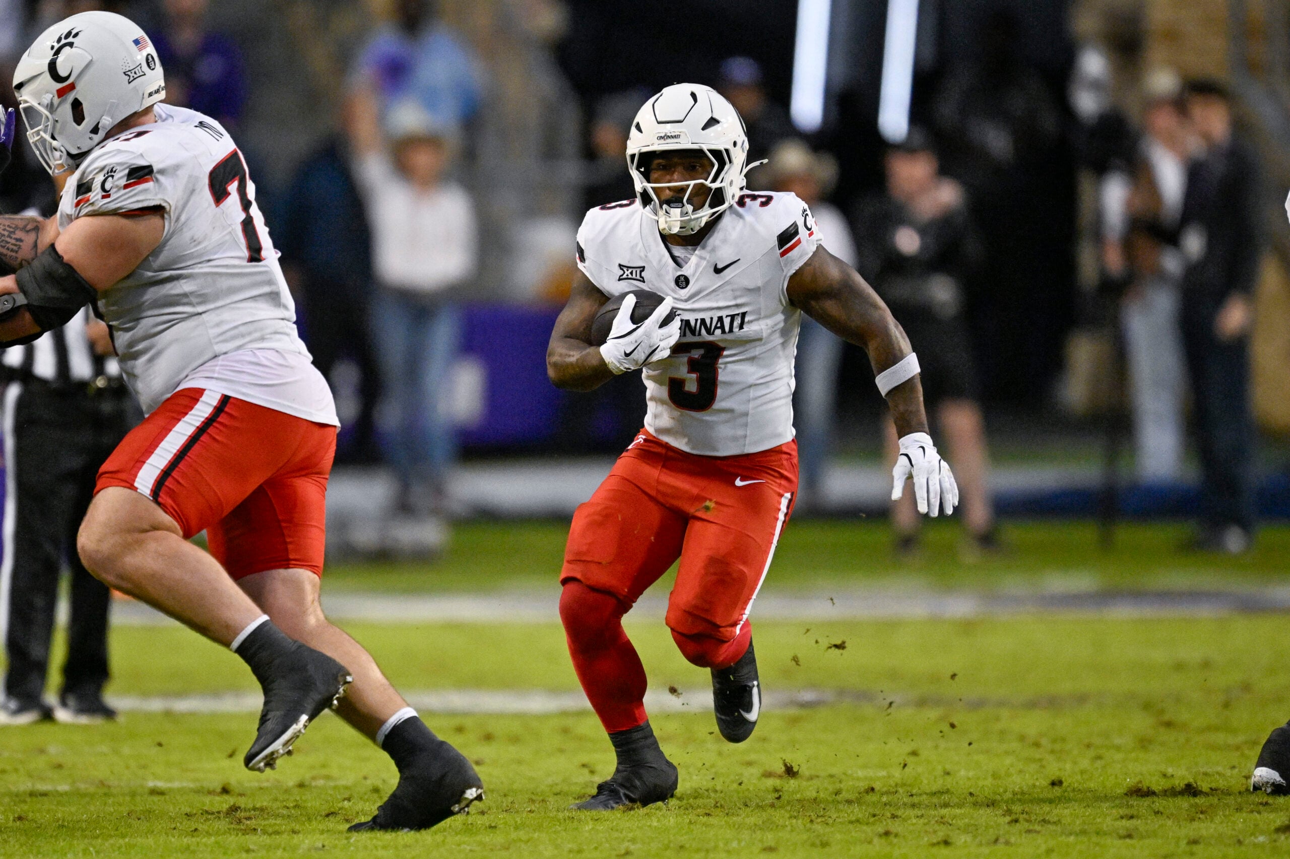 Nov 29, 2025; Fort Worth, Texas, USA; Cincinnati Bearcats running back Tawee Walker (3) runs with the ball during the game between the Horned Frogs and the Bearcats at Amon G. Carter Stadium. Mandatory Credit: Jerome Miron-Imagn Images