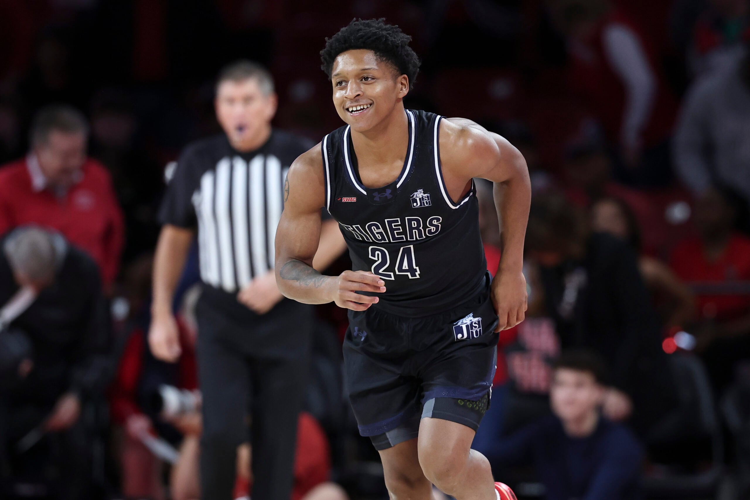 Dec 10, 2025; Houston, Texas, USA; Jackson State Tigers guard Daeshun Ruffin (24) smiles after a play during the first half against the Houston Cougars at Fertitta Center. Mandatory Credit: Troy Taormina-Imagn Images
