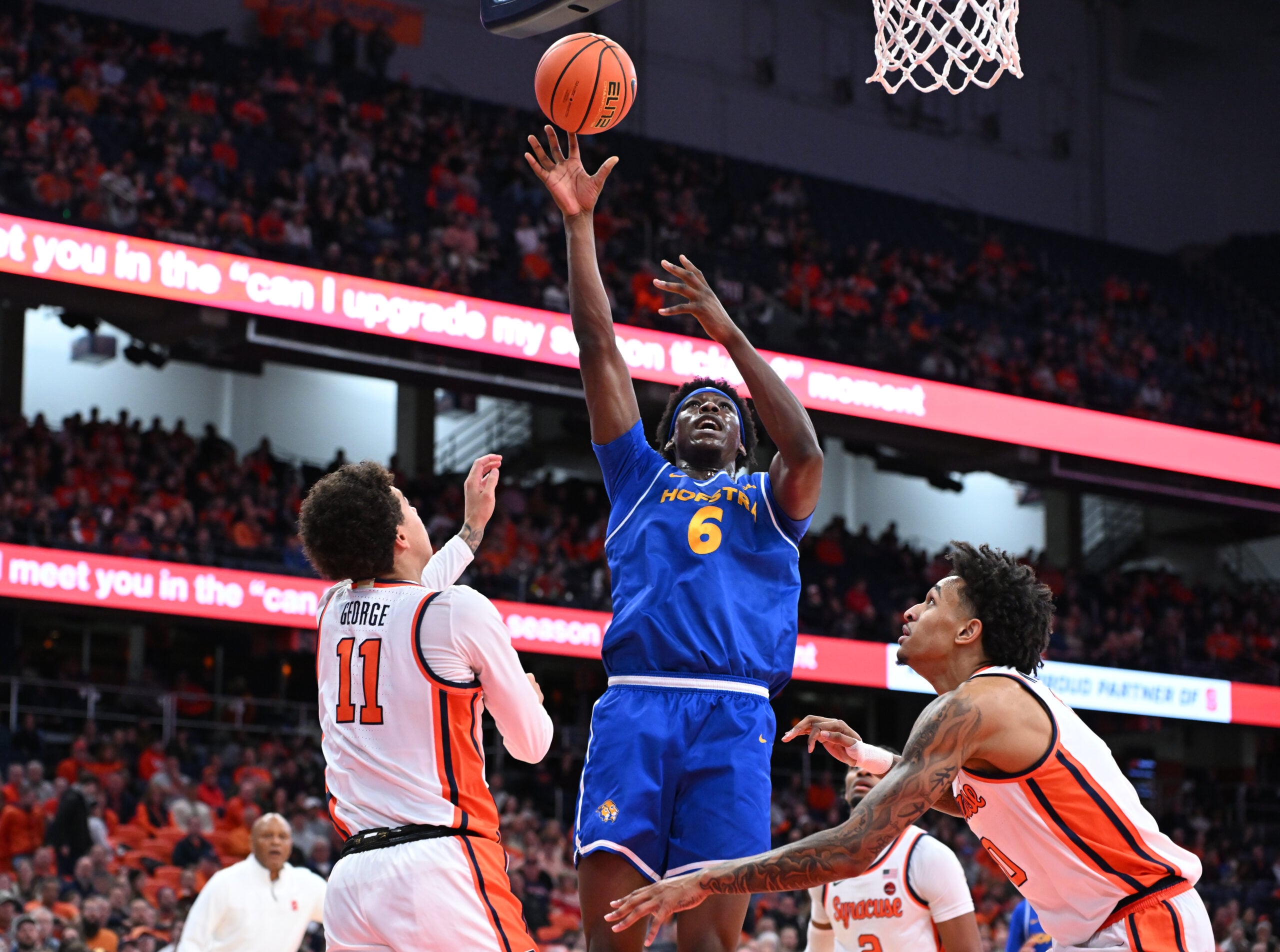 Dec 13, 2025; Syracuse, New York, USA; Hofstra Pride forward Victory Onuetu (6) shoots against Syracuse Orange guard Naithan George (11) and forward Sadiq White Jr. (0) defend in the first half at the JMA Wireless Dome. Mandatory Credit: Mark Konezny-Imagn Images